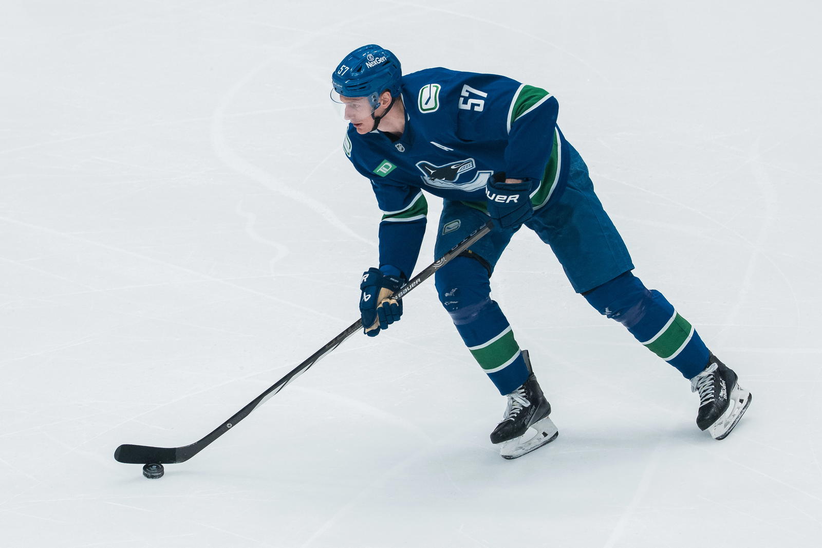 Mar 18, 2025; Vancouver, British Columbia, CAN; Vancouver Canucks defenseman Tyler Myers (57) handles the puck against the Winnipeg Jets in the second period at Rogers Arena. Mandatory Credit: Bob Frid-Imagn Images