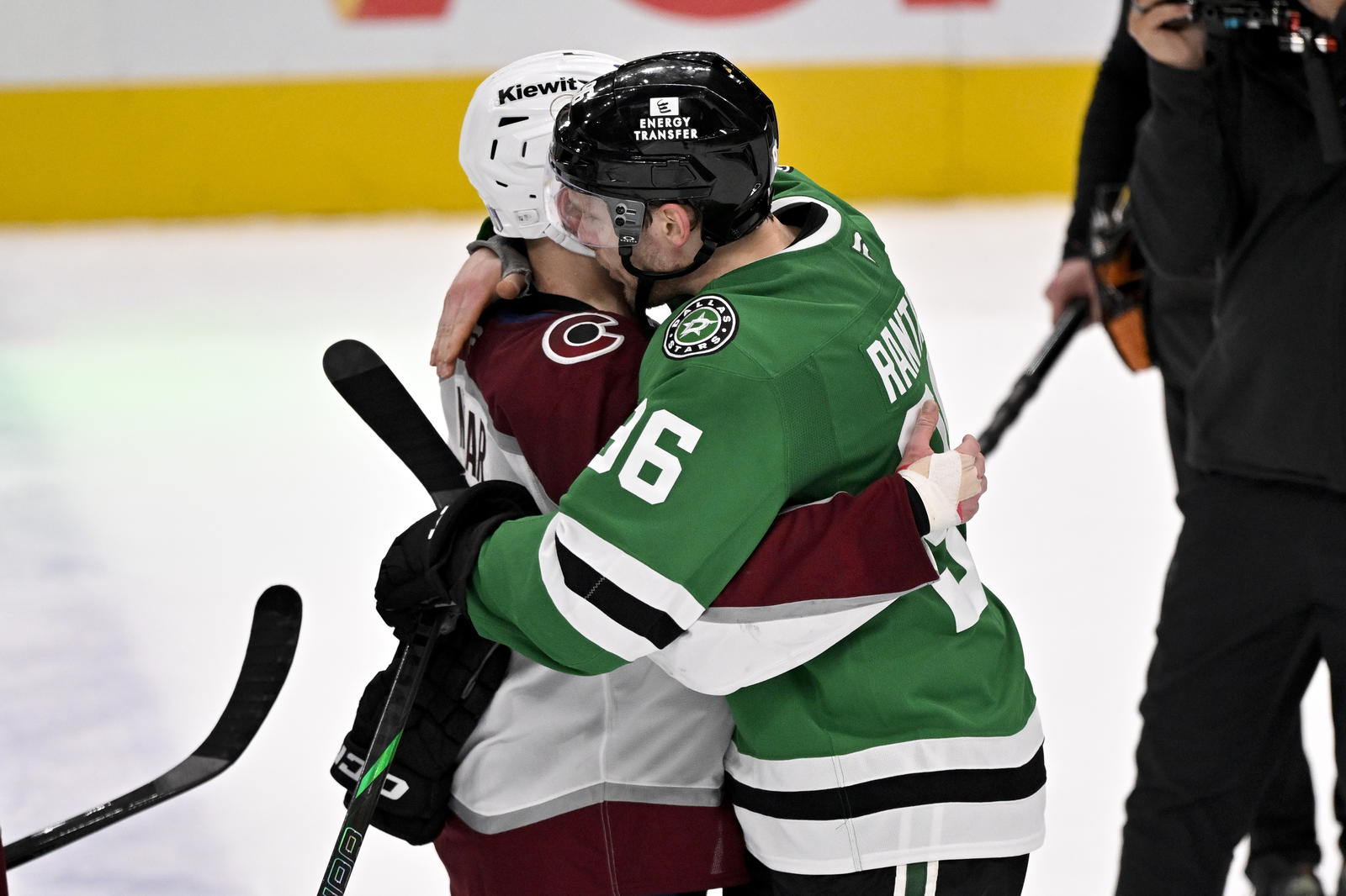 Colorado Avalanche defenseman Cale Makar (8) hugs Dallas Stars right wing Mikko Rantanen (96) after the Stars defeats the Avalanche in game seven of the first round of the 2025 Stanley Cup Playoffs at American Airlines Center. Mandatory Credit: Jerome Miron-Imagn Images