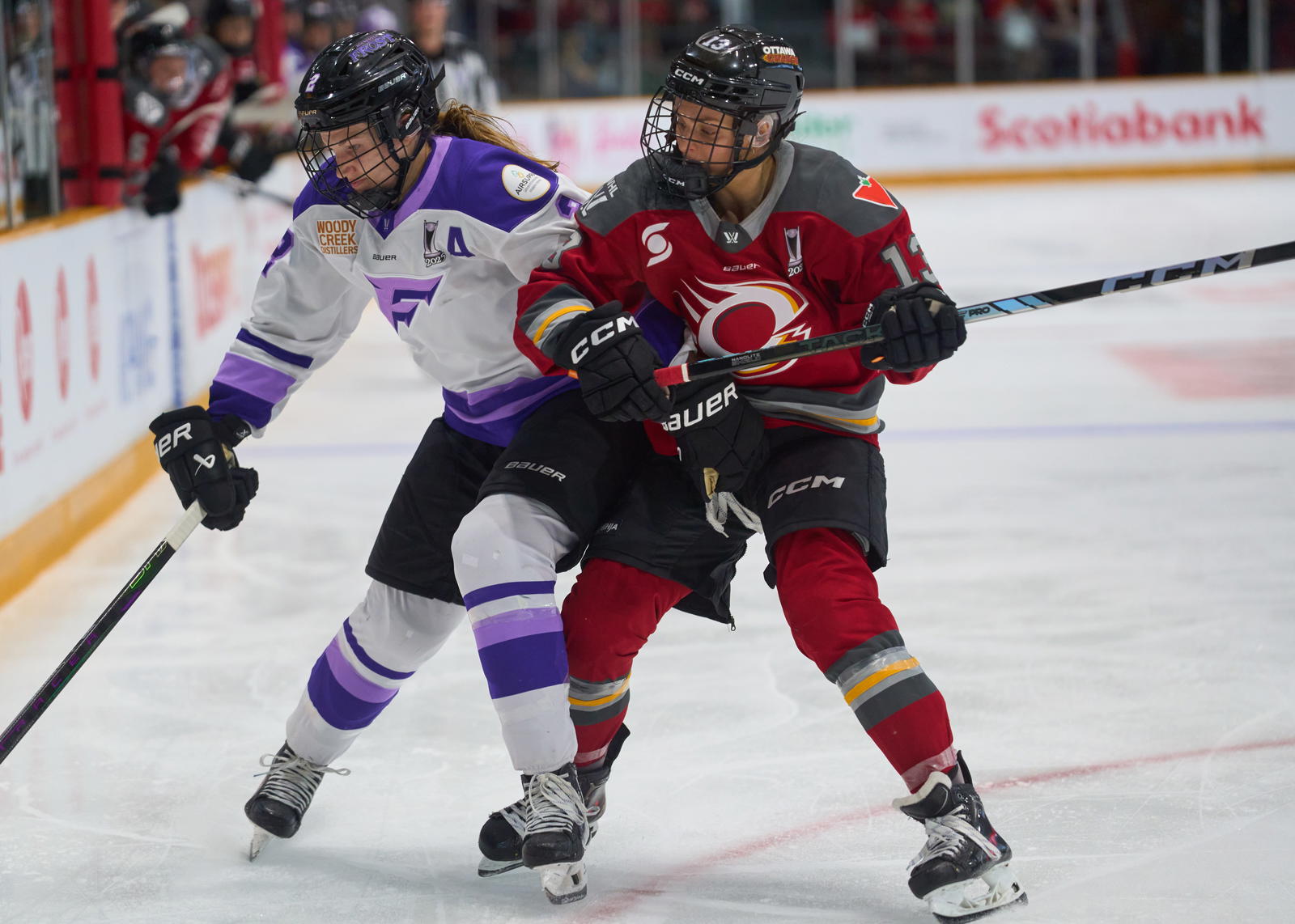 Lee Stecklein (2) of the Minnesota Frost fends off Ottawa Charge forward Tereza Vanisova (13) - Photo @ Ellen Bond