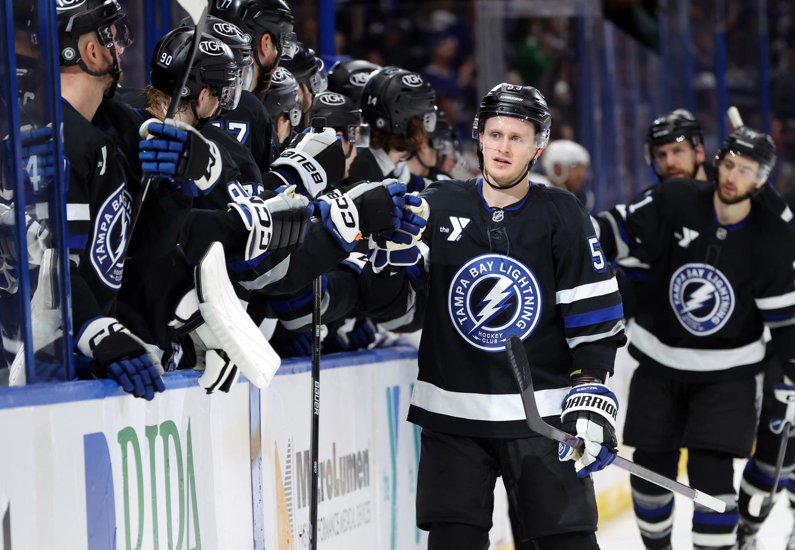 Apr 15, 2025; Tampa, Florida, USA; Tampa Bay Lightning center Jake Guentzel (59) is congratulated after he scored a goal against the Florida Panthers during the first period at Amalie Arena. (Kim Klement Neitzel-Imagn Images)