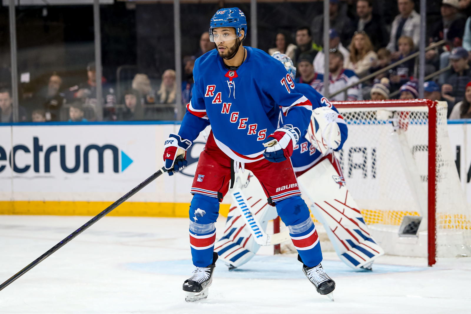 Mar 22, 2025; New York, New York, USA; New York Rangers defenseman K'Andre Miller (79) defends against the Vancouver Canucks during the second period at Madison Square Garden. (Danny Wild-Imagn Images)