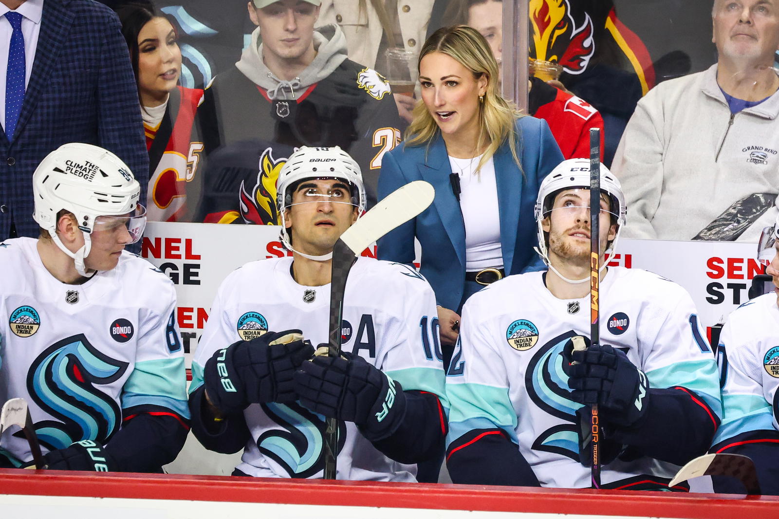 Feb 8, 2025; Calgary, Alberta, CAN; Seattle Kraken assistant coach Jessica Campbell on her bench during the first period against the Calgary Flames at Scotiabank Saddledome. (Credit: Sergei Belski-Imagn Images)