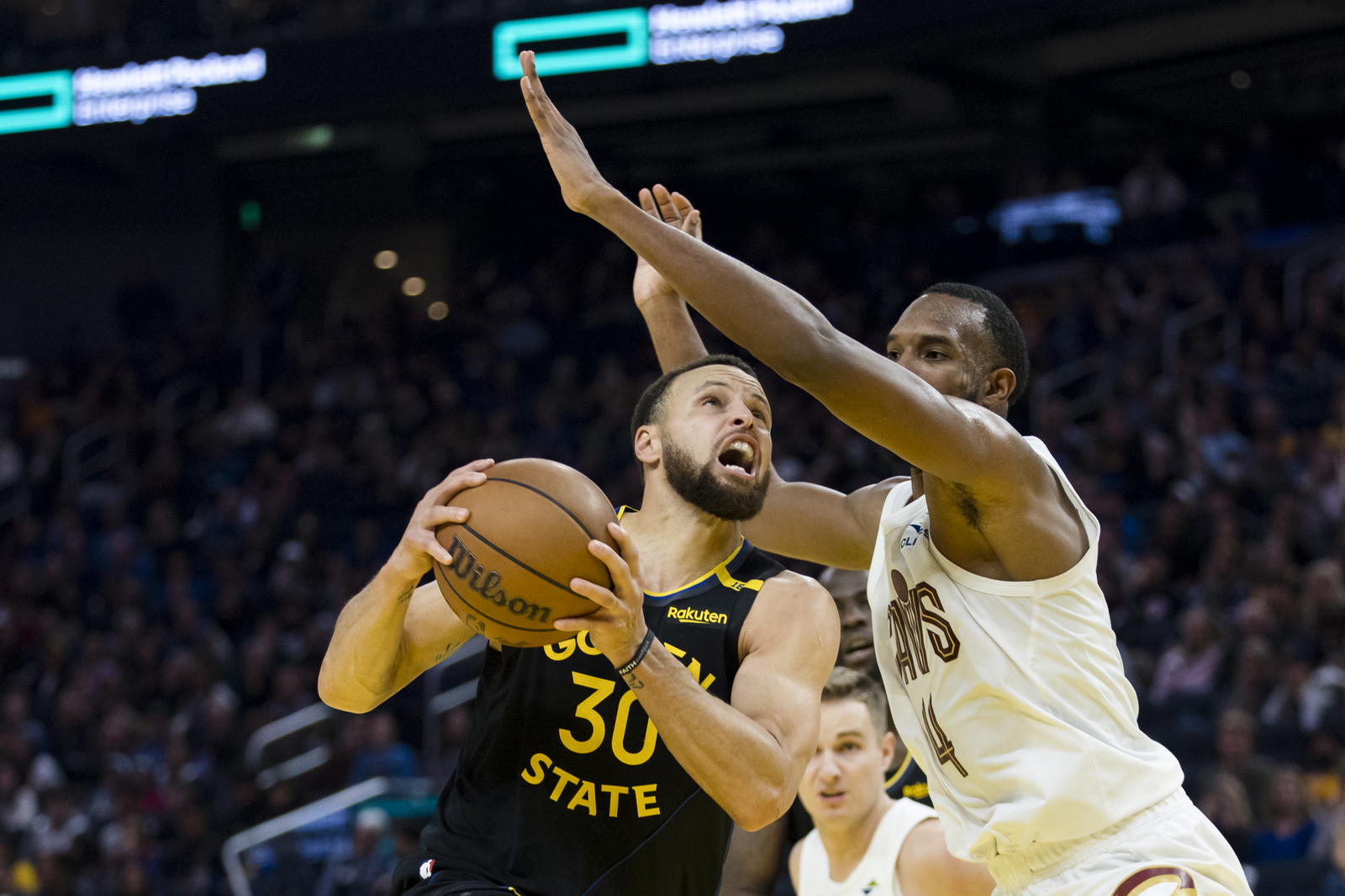 Cleveland Cavaliers forward Evan Mobley (4) defends against Golden State Warriors guard Stephen Curry (30) during the second quarter at Chase Center. John Hefti-Imagn Images