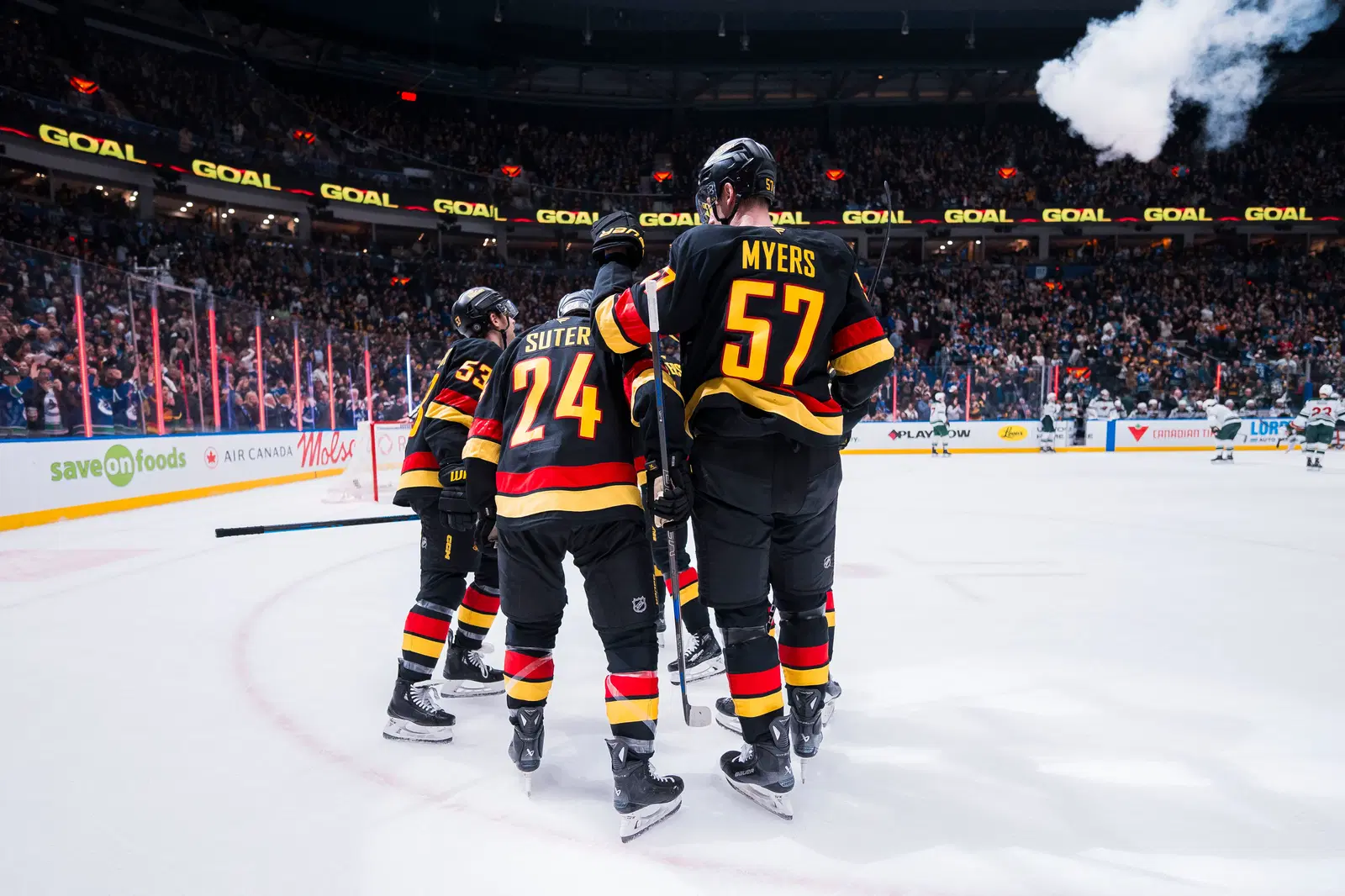 Mar 7, 2025; Vancouver, British Columbia, CAN; Vancouver Canucks forward Teddy Blueger (53) and forward Pius Suter (24) and defenseman Tyler Myers (57) and forward Elias Pettersson (40) and defenseman Marcus Pettersson (29) celebrate Blueger’s goal against the Minnesota Wild in the third period at Rogers Arena. Mandatory Credit: Bob Frid-Imagn Images