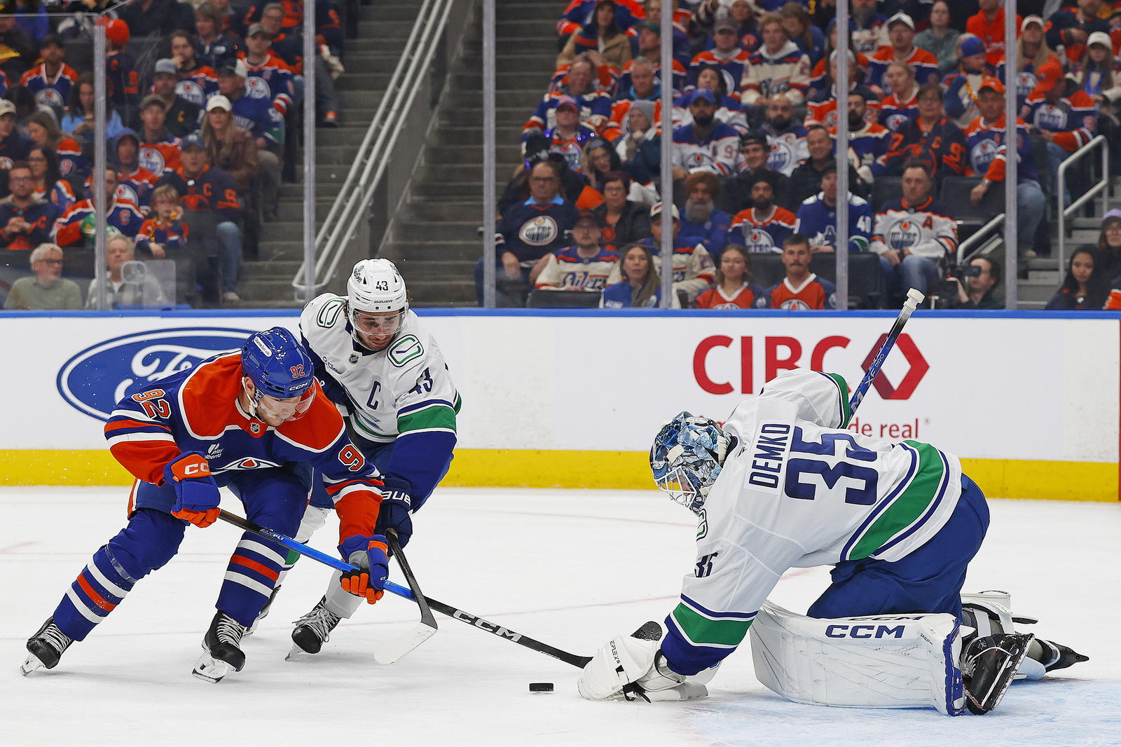Oct 11, 2025; Edmonton, Alberta, CAN; Vancouver Canucks goaltender Thatcher Demko (35) makes a save on Edmonton Oilers forward Vasily Podkolzin (92) during the third period at Rogers Place. Mandatory Credit: Perry Nelson-Imagn Images