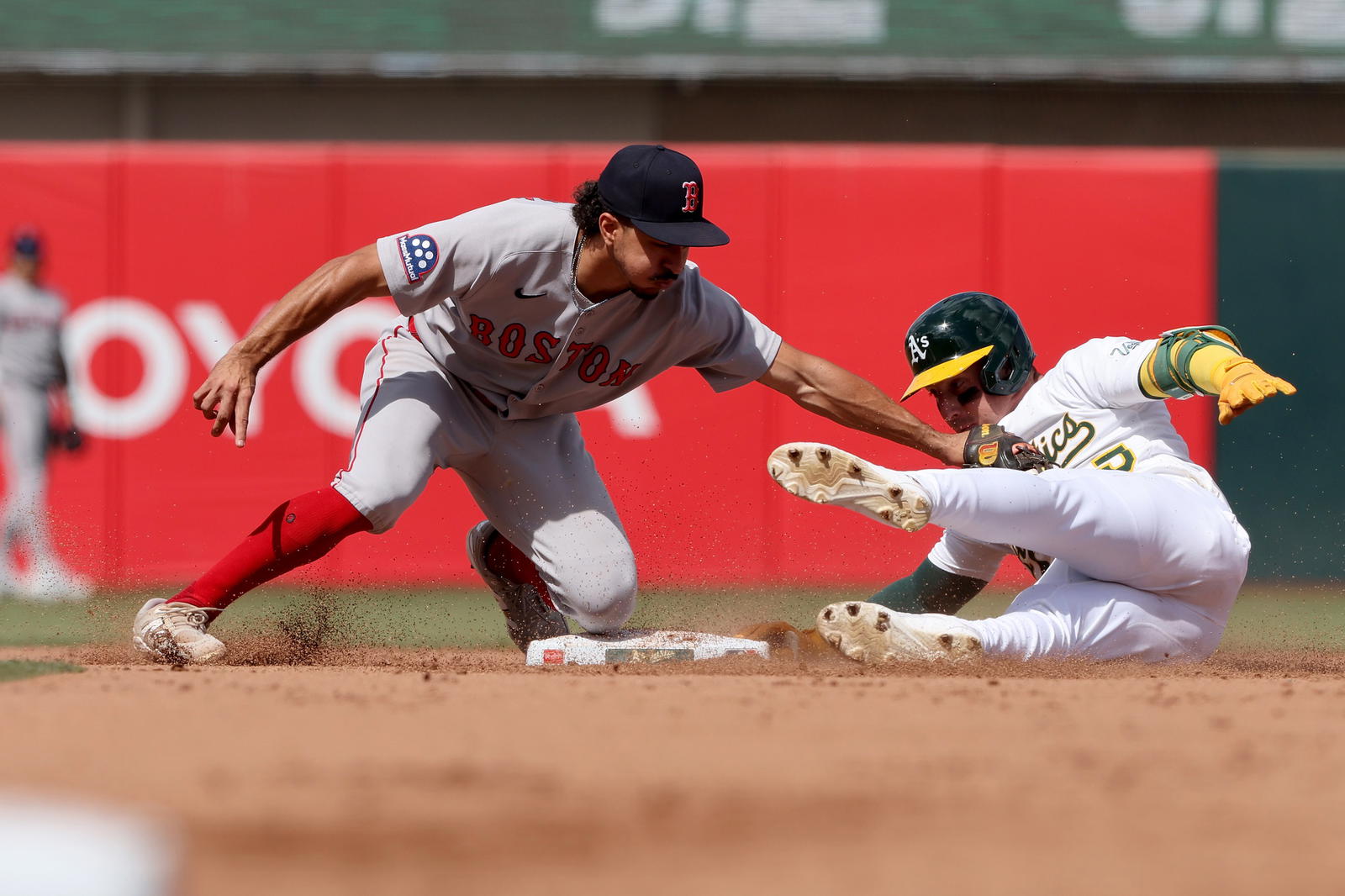 Sep 10, 2025; West Sacramento, California, USA; Athletics right fielder Brent Rooker (25) slides ahead of the tag from Boston Red Sox second baseman David Hamilton (17) during the fifth inning at Sutter Health Park. (Dennis Lee/Imagn Images)