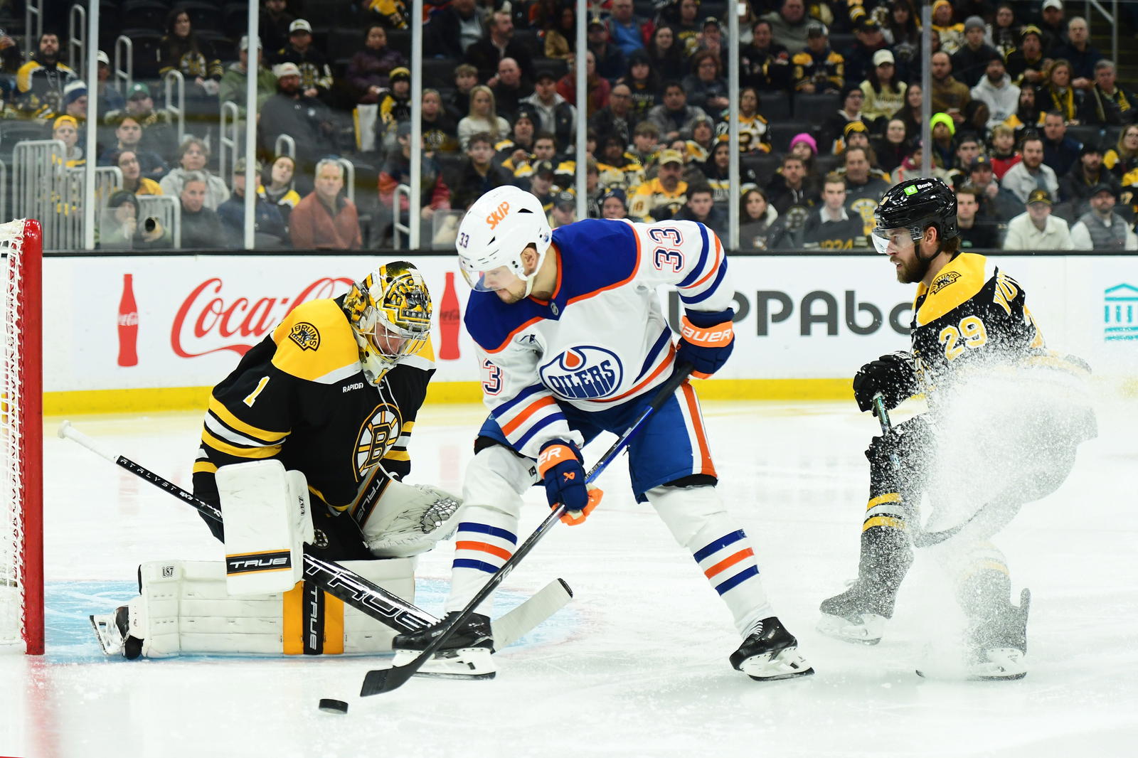 Jeremy Swayman, Viktor Arvidsson and Parker Wotherspoon (Bob DeChiara-Imagn Images)