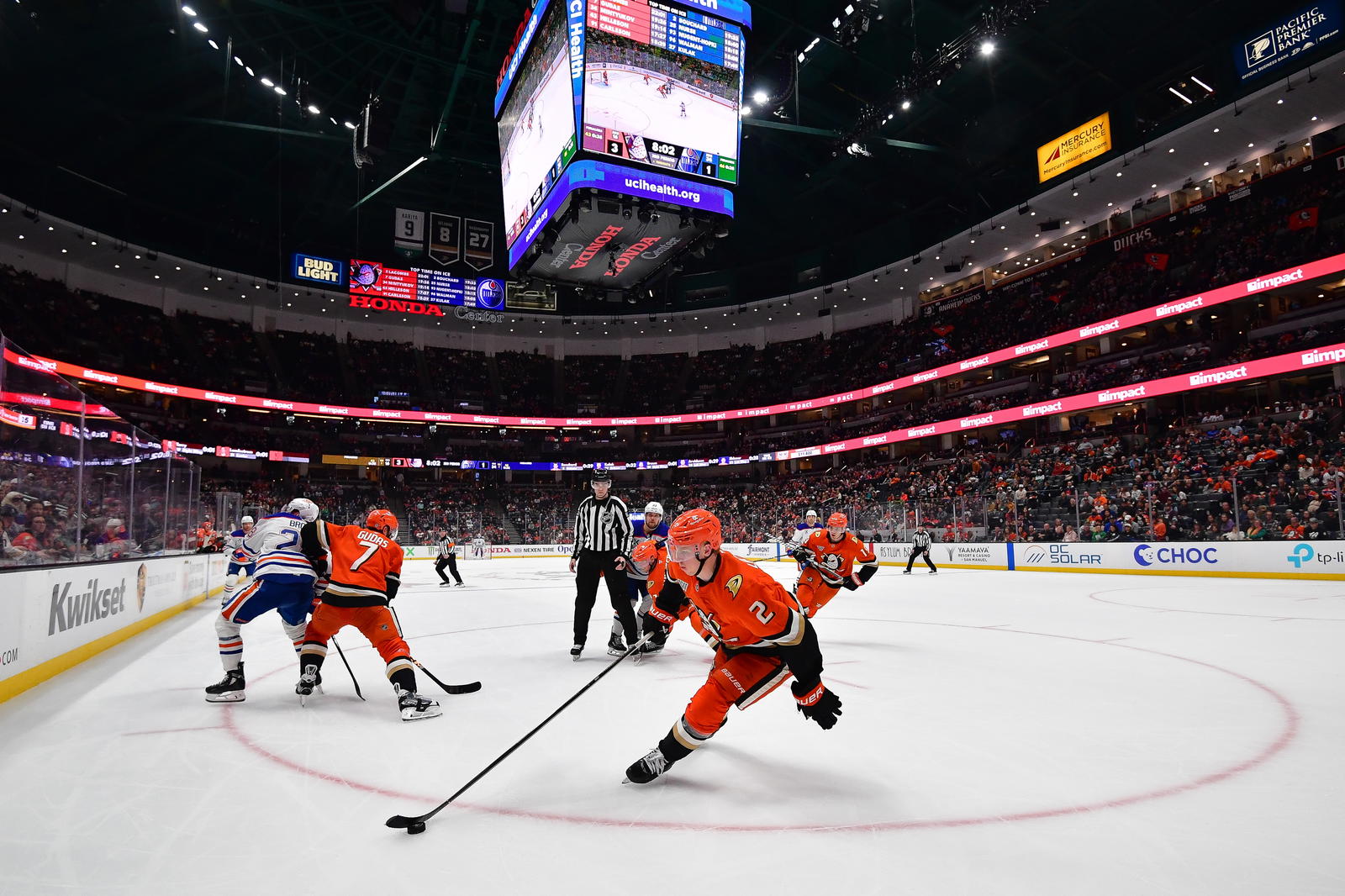 Apr 7, 2025; Anaheim, California, USA; Anaheim Ducks defenseman Jackson LaCombe (2) moves the puck against the Edmonton Oilers during the third period at Honda Center. Mandatory Credit: Gary A. Vasquez-Imagn Images