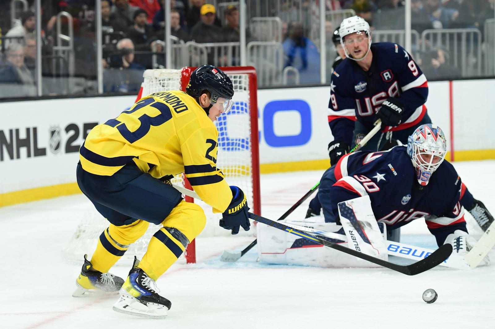 Feb 17, 2025; Boston, MA, USA; Team Sweden forward Lucas Raymond (23) handles the puck in front of Team USA goalie Jake Ottinger (30) during the second period in a 4 Nations Face-Off ice hockey game at TD Garden. Bob DeChiara, Imagn Images