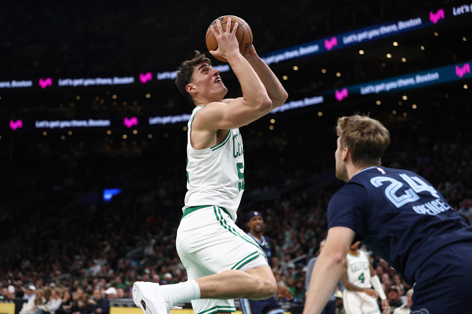 Nov 12, 2025; Boston, Massachusetts, USA; Boston Celtics center Luka Garza (52) shoots against the Memphis Grizzlies during the second half at TD Garden. (Winslow Townson/Imagn Images)