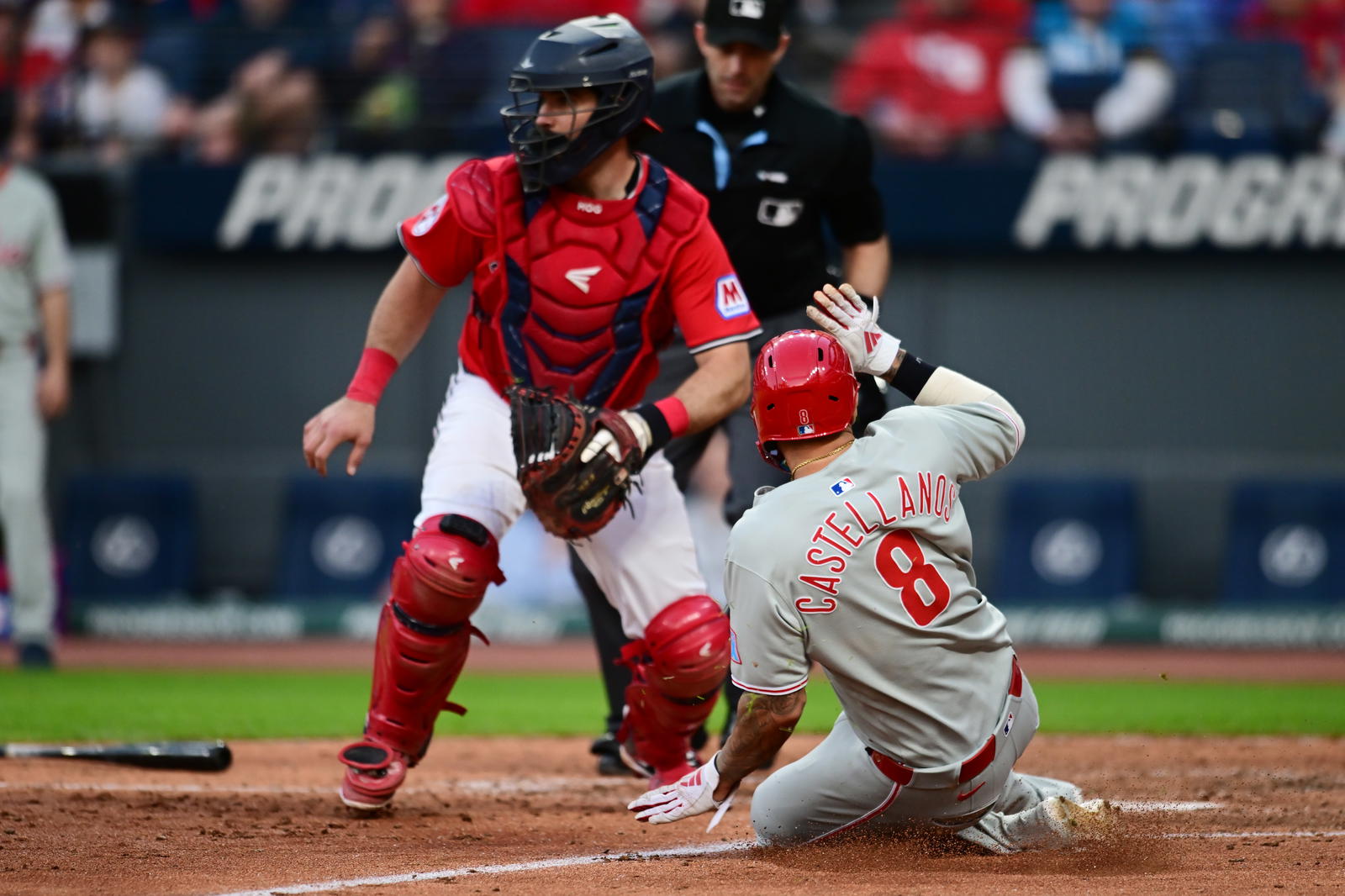 May 10, 2025; Cleveland, Ohio, USA; Philadelphia Phillies right fielder Nick Castellanos (8) scores during the eighth inning against the Cleveland Guardians at Progressive Field. Mandatory Credit: Ken Blaze-Imagn Images