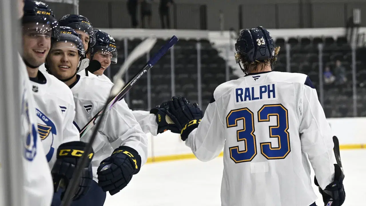 Colin Ralph (33) gets praise from fellow St. Louis Blues prospects during a 3-on-3 scrimmage recently at development camp. Ralph is transferring from St. Cloud State to Michigan State for the 2025-26 season. (St. Louis Blues photo)