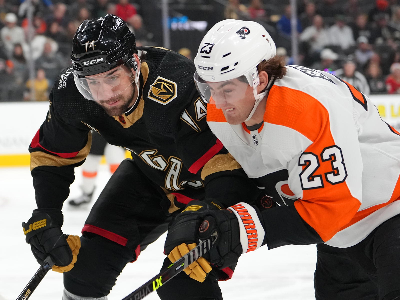Vegas Golden Knights defenseman Nicolas Hague (14) skates against Philadelphia Flyers center Lukas Sedlak (23) during the first period at T-Mobile Arena. Mandatory Credit: Stephen R. Sylvanie-Imagn Images