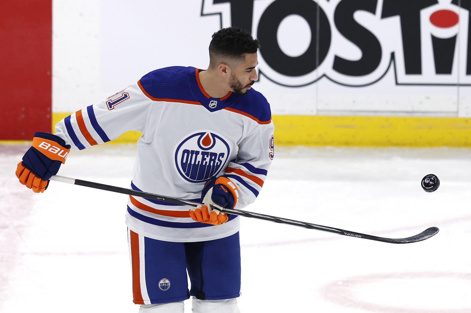 Mar 26, 2024; Winnipeg, Manitoba, CAN; Edmonton Oilers left wing Evander Kane (91) warms up before a game against the Winnipeg Jets at Canada Life Centre. Mandatory Credit: James Carey Lauder-Imagn Images