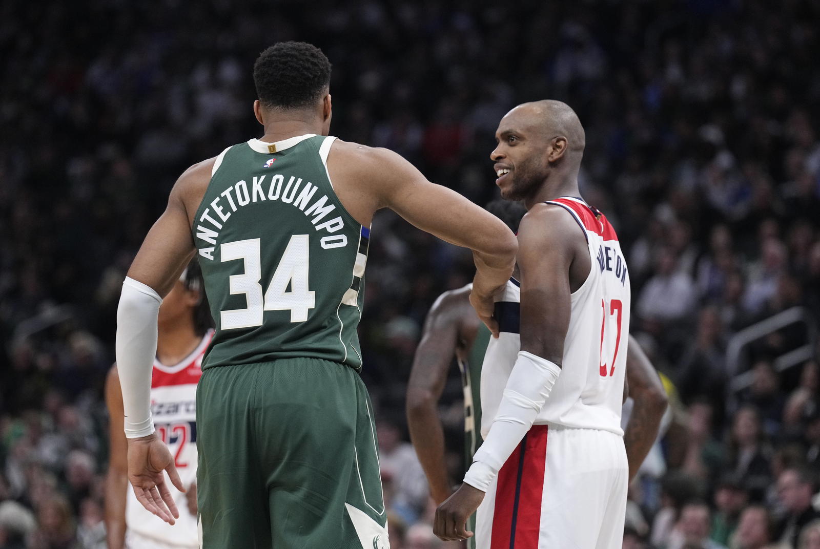 Milwaukee Bucks forward Giannis Antetokounmpo (34) and Washington Wizards forward Khris Middleton (22) joke around during their game at Fiserv Forum. Michael McLoone-Imagn Images