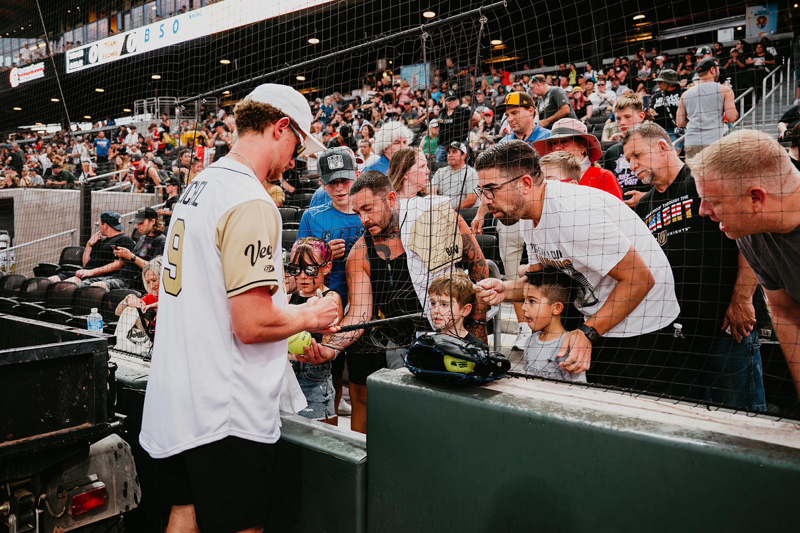 <i><b>Golden Knights star Jack Eichel signs autographs before the 2024 Battle For Vegas charity softball event at Las Vegas Ballpark PHOTO: Courtesy Battle For Vegas</b></i>