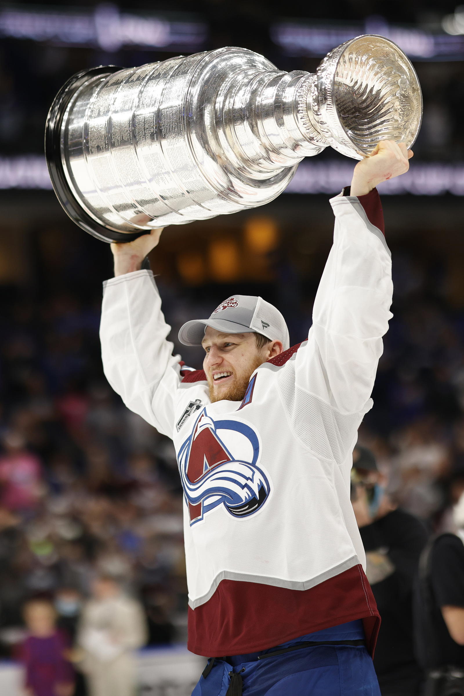 Nathan MacKinnon hoists the Stanley Cup following the Avalanche's 2-1 victory over the Tampa Bay Lightning in Game 6 of the 2022 Stanley Cup Final. Credit: Geoff Burke