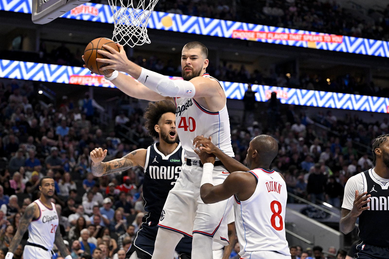 LA Clippers center Ivica Zubac (40) grabs a rebound against the Dallas Mavericks during the second half in an NBA Cup game at the American Airlines Center. Jerome Miron-Imagn Images