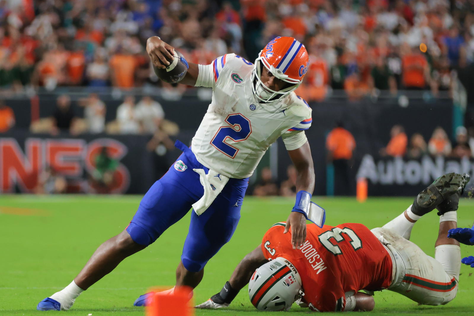 Florida Gators quarterback DJ Lagway runs the football against the Miami Hurricanes.<br>Sam Navarro-Imagn Images