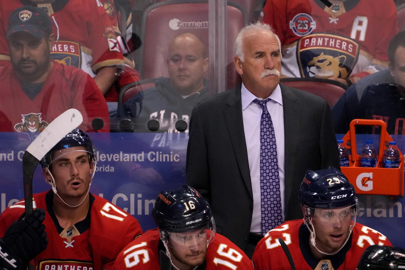 Oct 27, 2021; Sunrise, Florida, USA; Florida Panthers head coach Joel Quenneville stands behind the bench during the first period between the Florida Panthers and the Boston Bruins at FLA Live Arena. Mandatory Credit: Jasen Vinlove-Imagn Images
