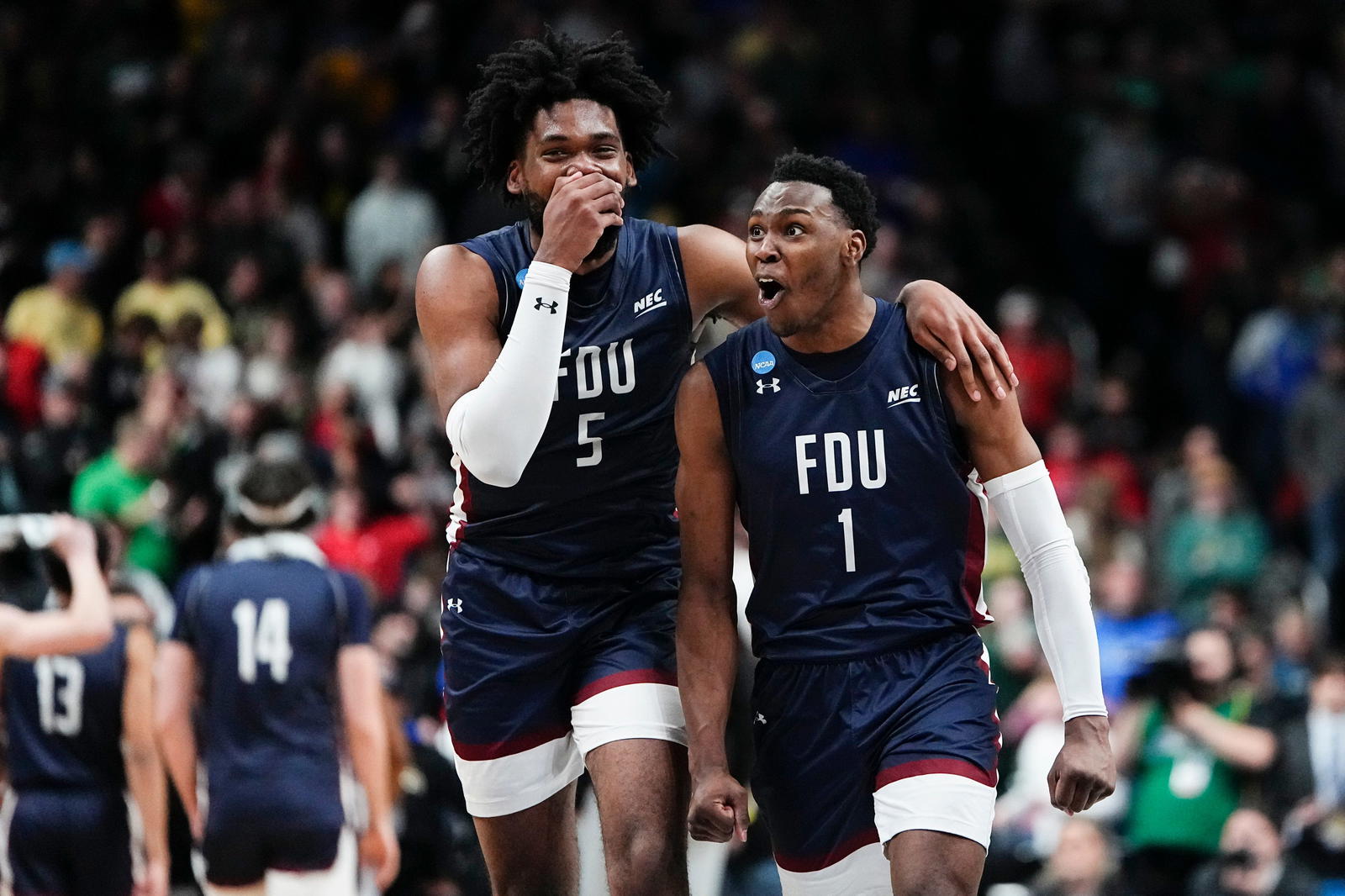 Fairleigh Dickinson Knights guard Joe Munden Jr. (1) and forward Ansley Almonor (5) celebrate their 63-58 win over the No. 1 seed Purdue Boilermakers during the first round of the NCAA men’s basketball tournament at Nationwide Arena. Marquette won 78-61 in 2023.