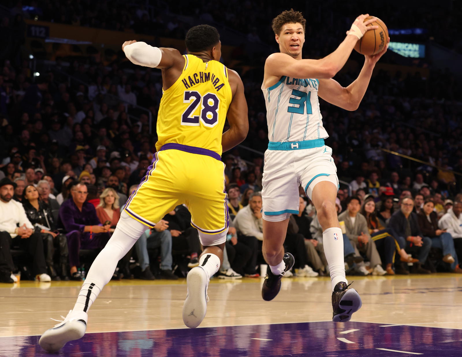 Charlotte Hornets forward Tidjane Salaun (31) drives against Los Angeles Lakers forward Rui Hachimura (28) during the fourth quarter at Crypto.com Arena.&nbsp;Jason Parkhurst-Imagn Images