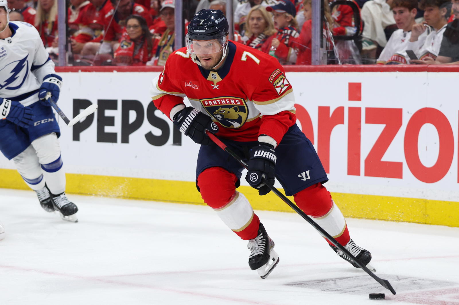 Apr 26, 2025; Sunrise, Florida, USA; Florida Panthers defenseman Dmitry Kulikov (7) controls the puck against the Tampa Bay Lightning in the second period during game three of the first round of the 2025 Stanley Cup Playoffs at Amerant Bank Arena. (Nathan Ray Seebeck-Imagn Images)