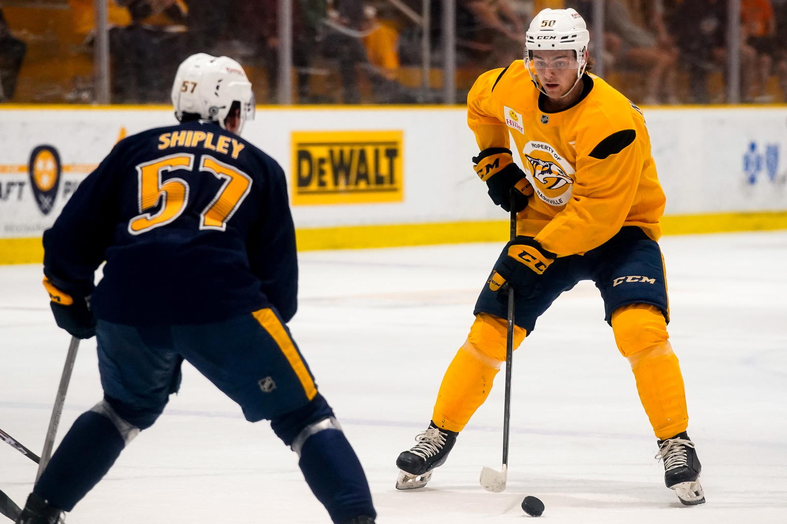 Gold team defenseman Tanner Molendyk (50) looks to shoot past Blue team defenseman Luke Shipley (57) during the Future Stars Game at the Ford Ice Center Bellevue in Nashville, Tenn., Saturday, July 5, 2025. Andrew Nelles / The Tennessean / USA TODAY NETWORK via Imagn Images
