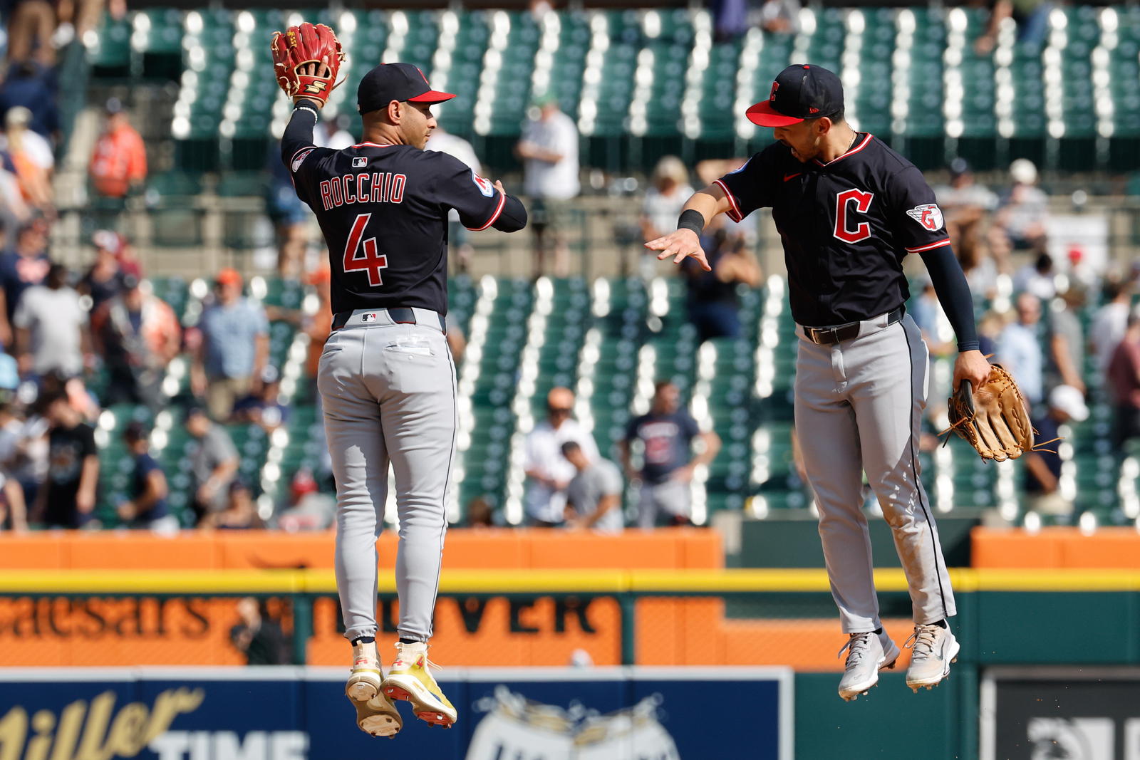 Sep 18, 2025; Detroit, Michigan, USA; Cleveland Guardians' Brayan Rocchio (4) and Steven Kwan (38) celebrate after the final out against the Detroit at Comerica Park. Mandatory Credit: Rick Osentoski-Imagn Images