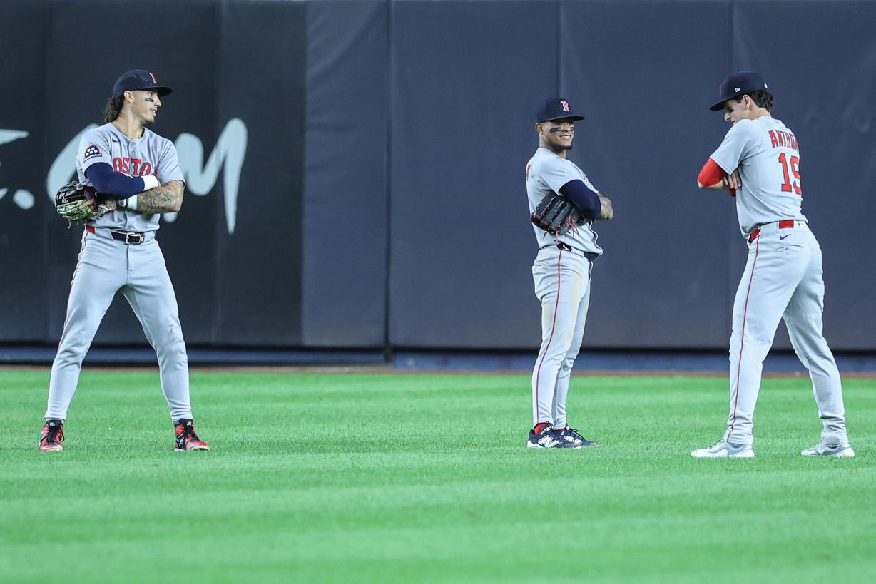 Aug 21, 2025; Bronx, New York, USA; Boston Red Sox left fielder Jarren Duran (16), center fielder Ceddanne Rafaela (3) and right fielder Roman Anthony (19) pose after defeating the New York Yankees 6-3 at Yankee Stadium. (Wendell Cruz/Imagn Images)