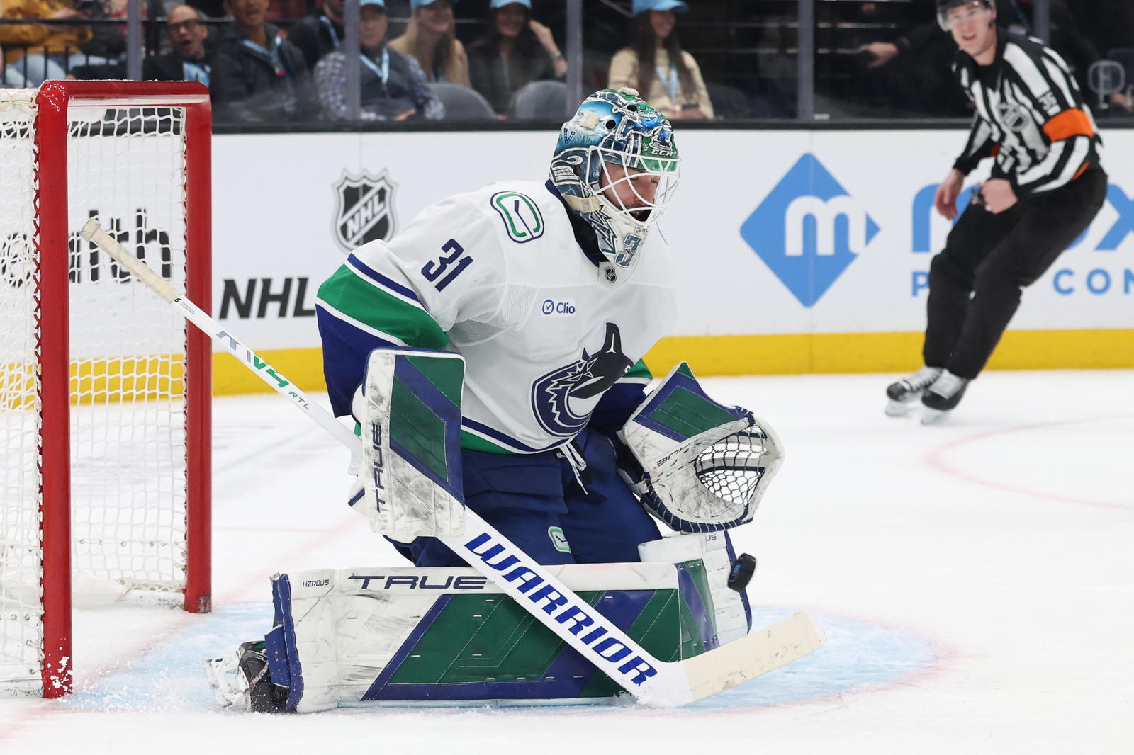 Feb 23, 2025; Salt Lake City, Utah, USA; Vancouver Canucks goaltender Arturs Silovs (31) blocks a shot against the Utah Hockey Club during the second period at Delta Center. Mandatory Credit: Rob Gray-Imagn Images