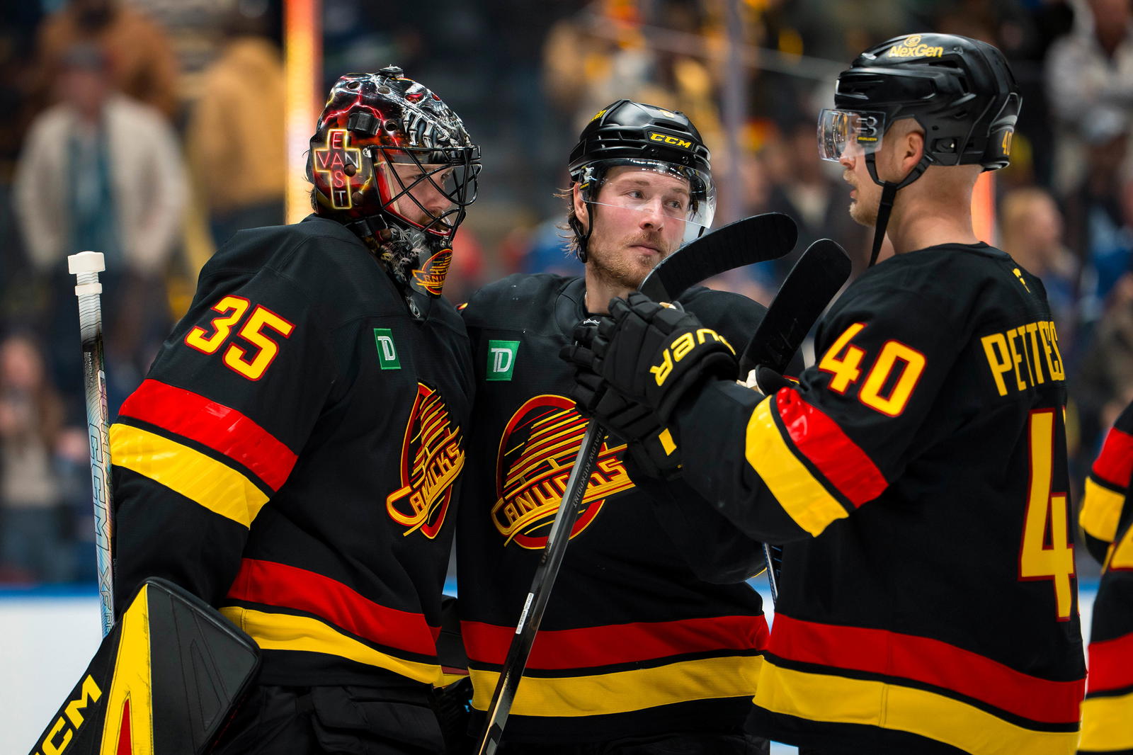 Oct 9, 2025; Vancouver, British Columbia, CAN; Vancouver Canucks goalie Thatcher Demko (35) and forward Brock Boeser (6) and forward Elias Pettersson (40) celebrate thier victory against the Calgary Flames at Rogers Arena. Mandatory Credit: Bob Frid-Imagn Images
