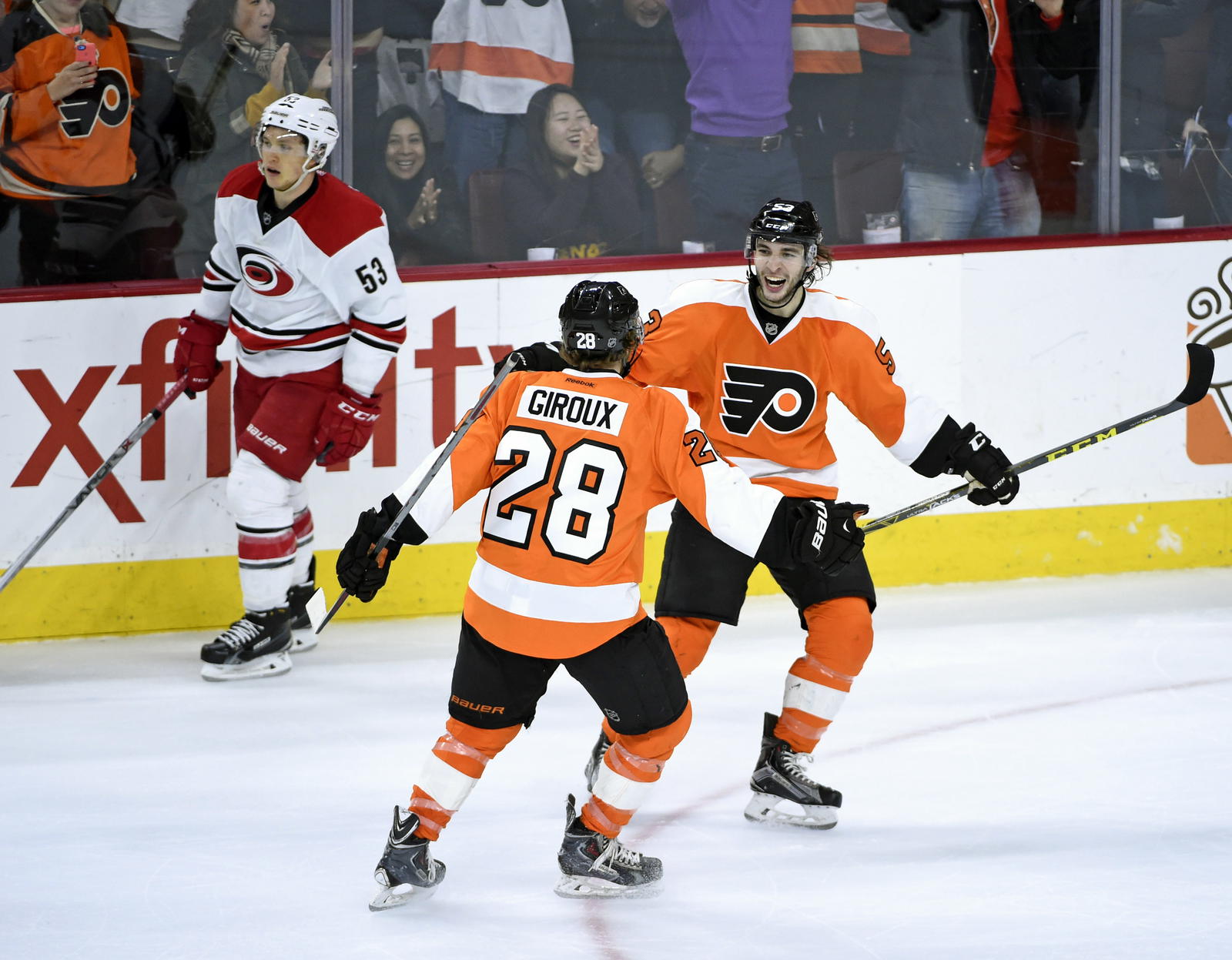 Dec 15, 2015; Philadelphia, PA, USA; Philadelphia Flyers defenseman Shayne Gostisbehere (53) celebrates scoring the game winning goal with center Claude Giroux (28) against the Carolina Hurricanes during overtime at Wells Fargo Center. The Flyers defeated the Hurricanes, 4-3 in overtime. (Eric Hartline-Imagn Images)
