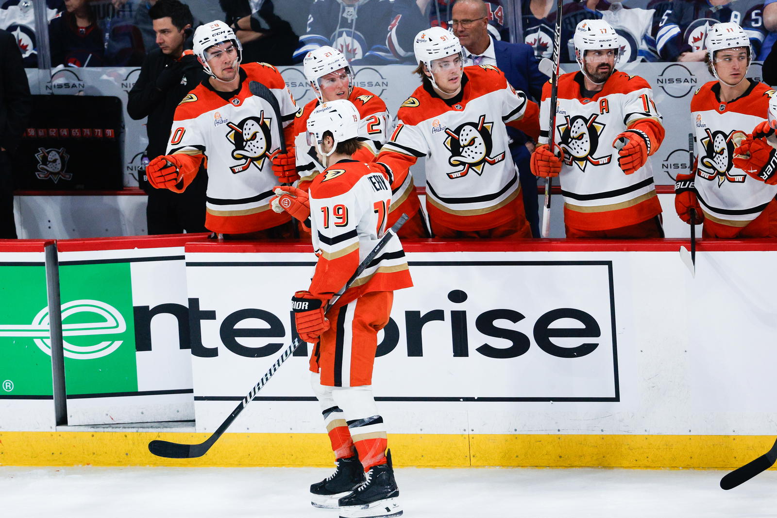 Troy Terry is congratulated by his teammates after his goal against the Winnipeg Jets. (Terrence Lee-Imagn Images)