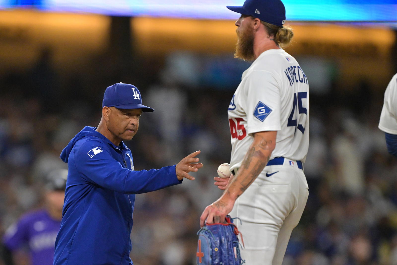 Sep 10, 2025; Los Angeles, California, USA; Los Angeles Dodgers manager Dave Roberts (30) pulls relief pitcher Michael Kopech (45) from the seventh inning against the Colorado Rockies at Dodger Stadium. (Jayne Kamin/Oncea-Imagn Images)