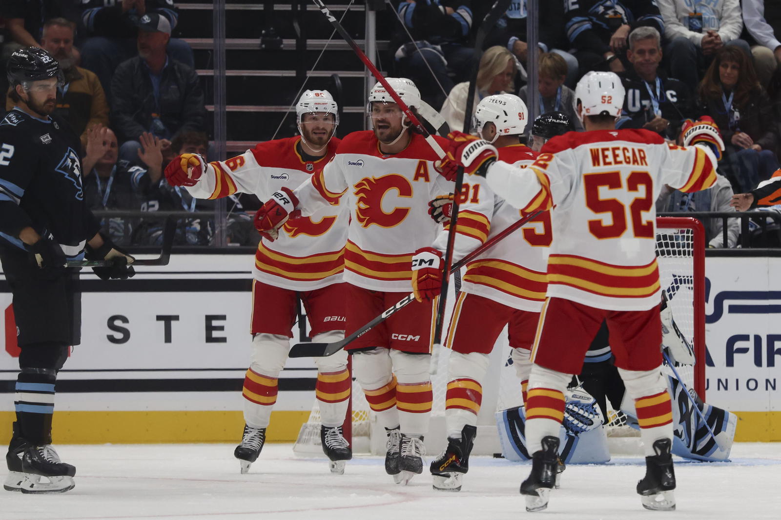 The Calgary Flames celebrate a power-play goal by defenceman Rasmus Andersson (4) against the Utah Mammoth during their game at the Delta Center in Salt Lake City, Utah (Source: Rob Gray-Imagn Images)