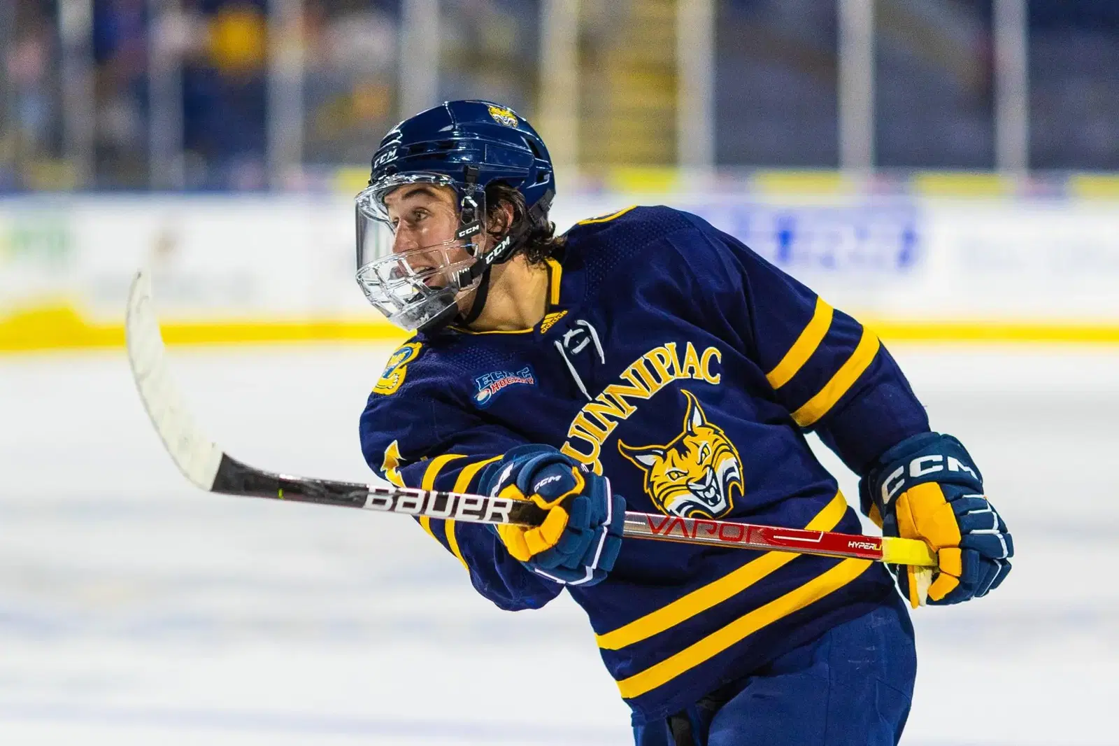 #27 Travis Treloar of the Quinnipiac Bobcats takes a shot on net during a game. via quchronicle.com