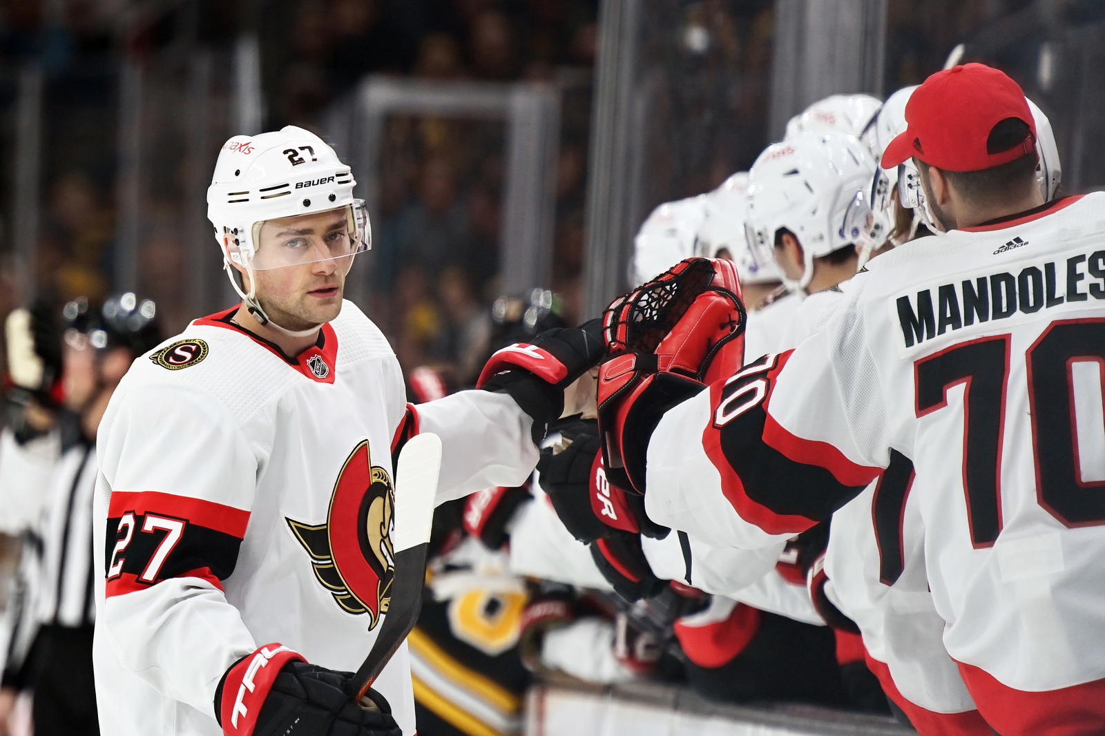 Mar 21, 2023; Boston, Massachusetts, USA; Ottawa Senators center Dylan Gambrell (27) is congratulated by his teammates after scoring a goal during the first period against the Boston Bruins at TD Garden. Mandatory Credit: Bob DeChiara-Imagn Images