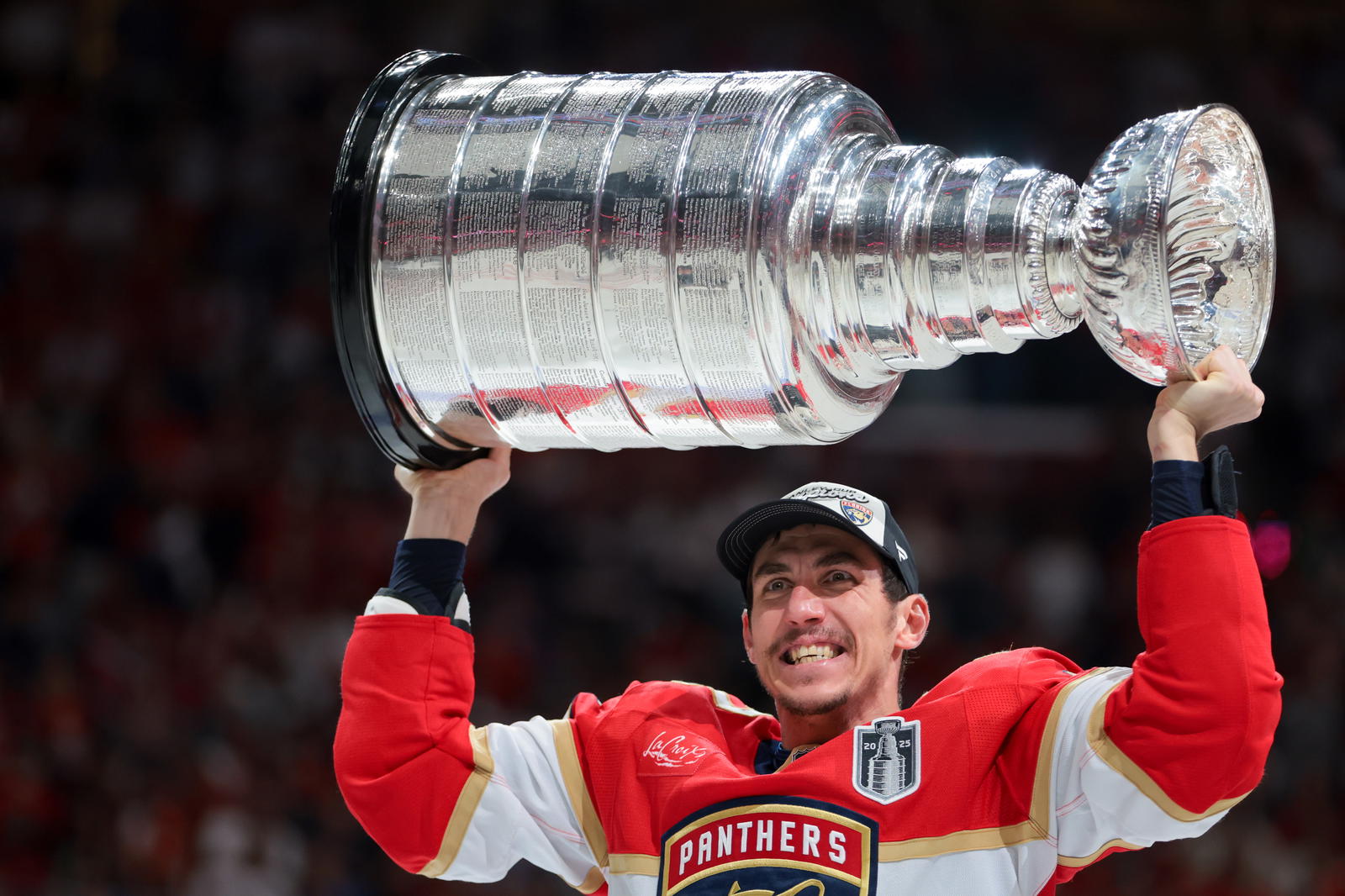 Florida Panthers left wing Tomas Nosek (92) hoists the Stanley Cup after winning game six of the 2025 Stanley Cup Final against the Edmonton Oilers at Amerant Bank Arena. Mandatory Credit: Sam Navarro-Imagn Images