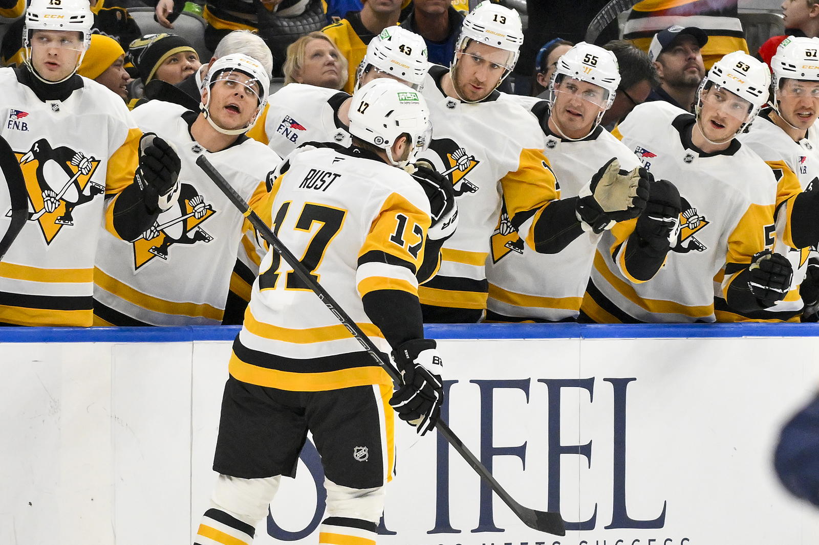 Apr 3, 2025; St. Louis, Missouri, USA; Pittsburgh Penguins right wing Bryan Rust (17) is congratulated by teammates after scoring against the St. Louis Blues during the first period at Enterprise Center. Mandatory Credit: Jeff Curry-Imagn Images