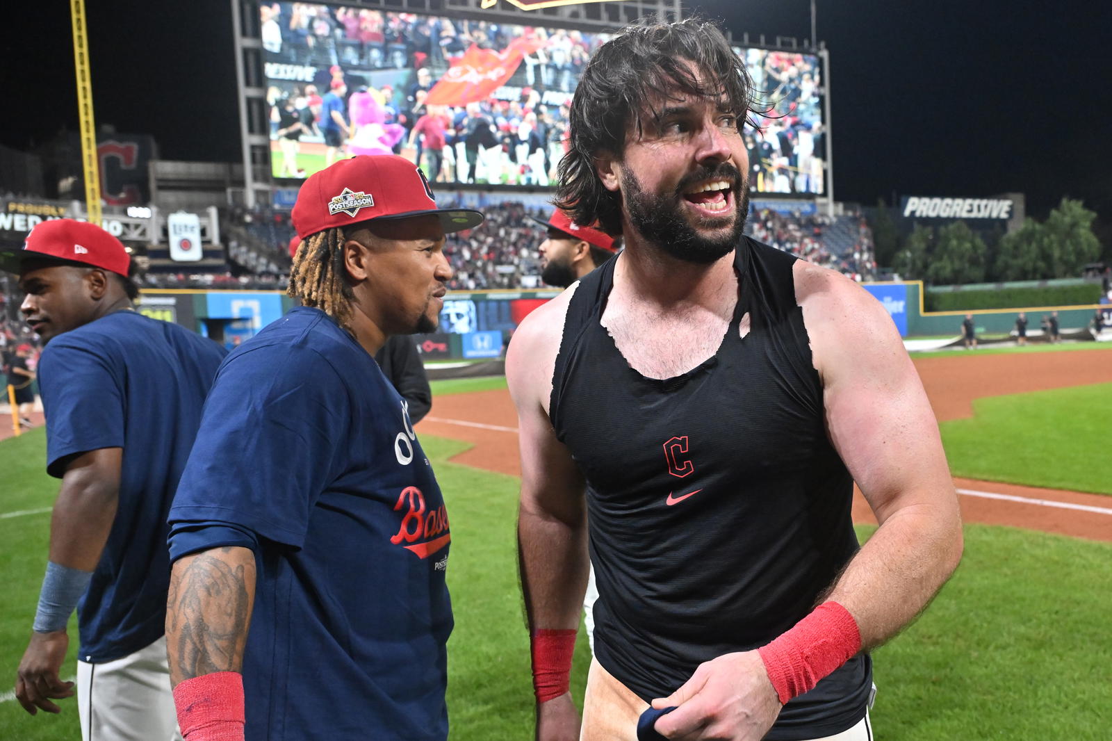 Sep 27, 2025; Cleveland, Ohio, USA; Cleveland Guardians catcher Austin Hedges (27) and third baseman Jose Ramirez, left, celebrate after the Guardians beat the Texas Rangers to secure a playoff berth at Progressive Field. Mandatory Credit: Ken Blaze-Imagn Images