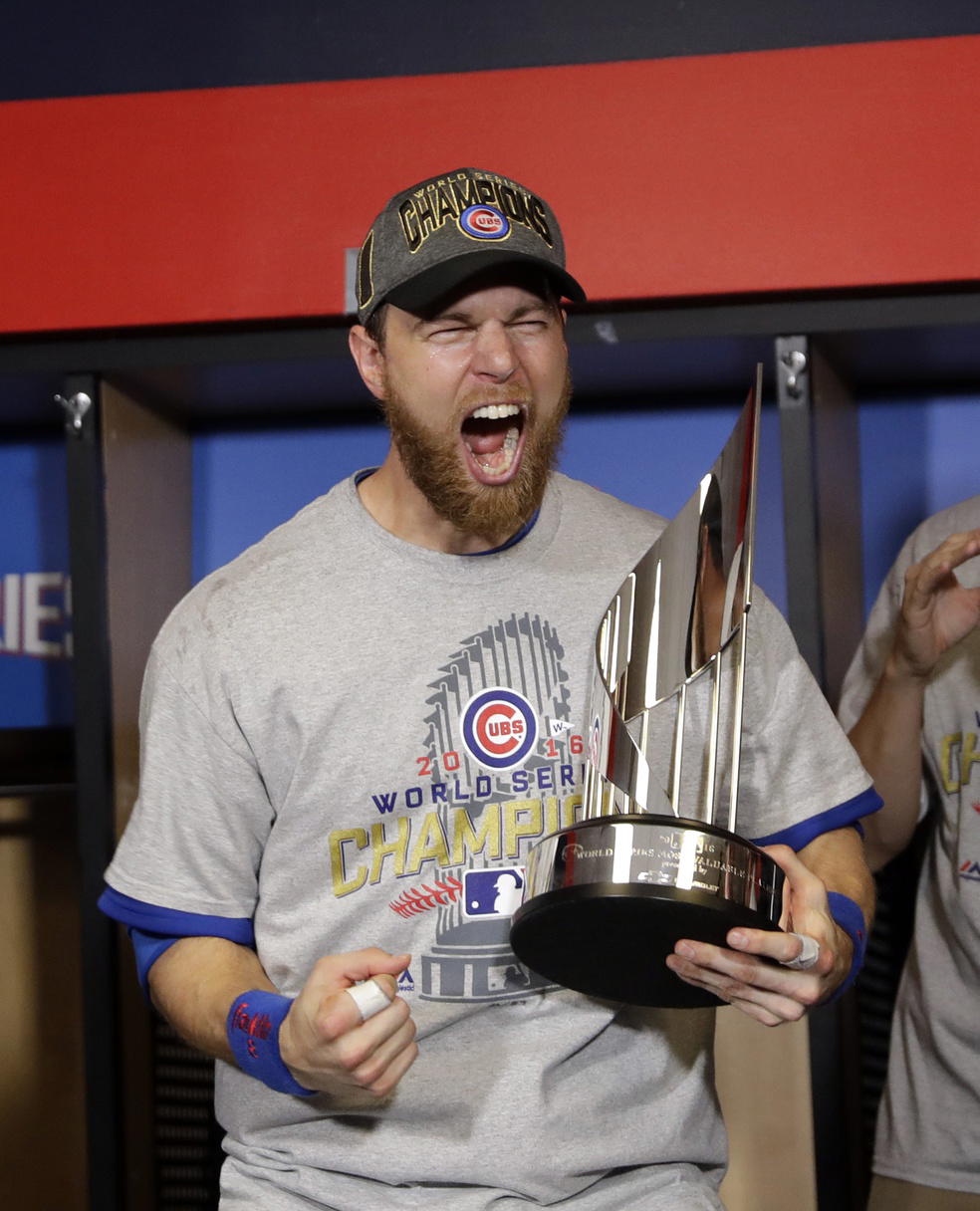Chicago Cubs outfielder Ben Zobrist (18) celebrates with the MVP trophy after Game 7 of the 2016 World Series. David J. Phillip/Pool Photo via Imagn Images