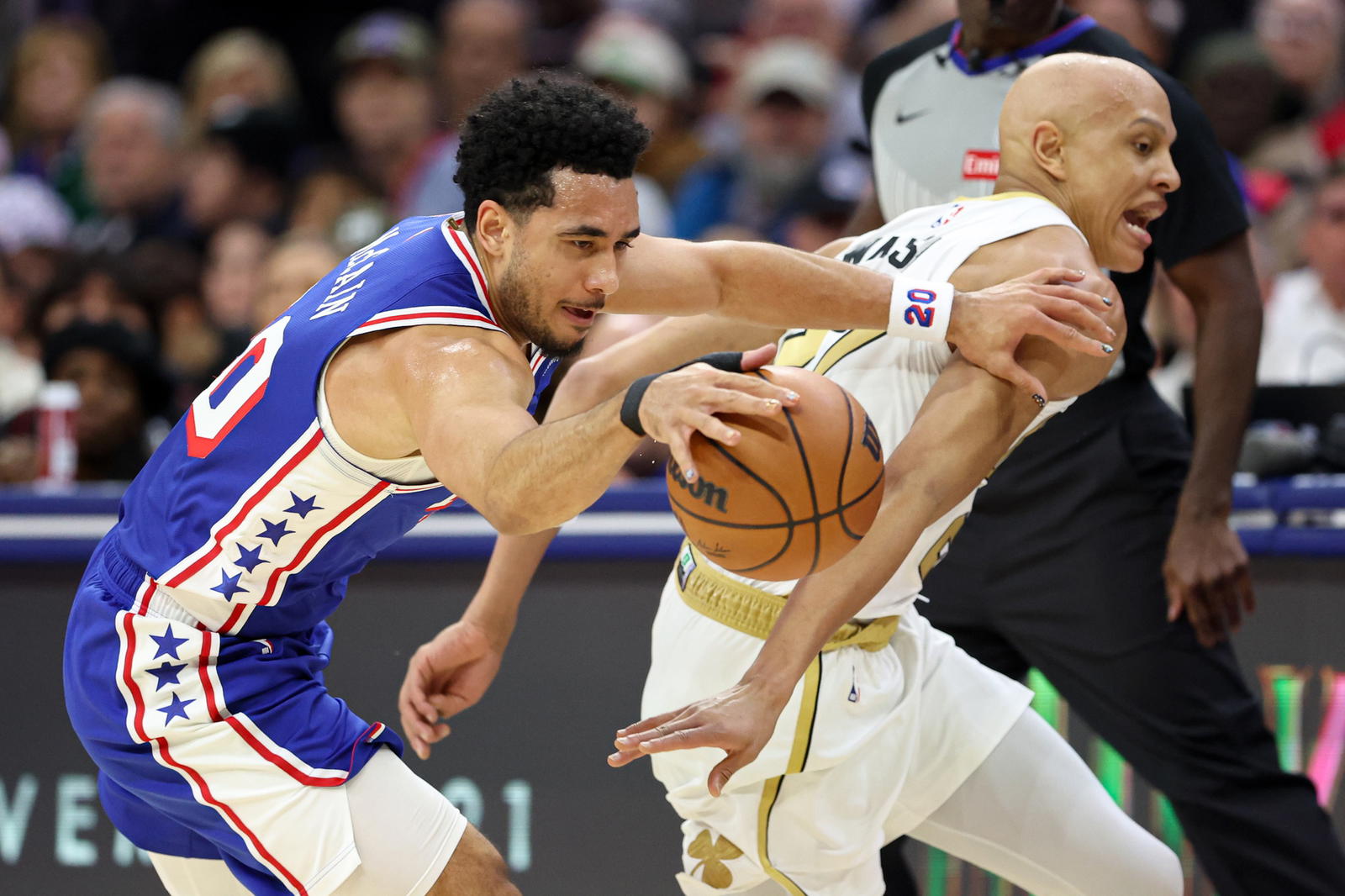 Nov 11, 2025; Philadelphia, Pennsylvania, USA; Philadelphia 76ers guard Jared McCain (20) picks up a loose ball past Boston Celtics guard Jordan Walsh (27) during the second quarter at Xfinity Mobile Arena. (Bill Streicher/Imagn Images)