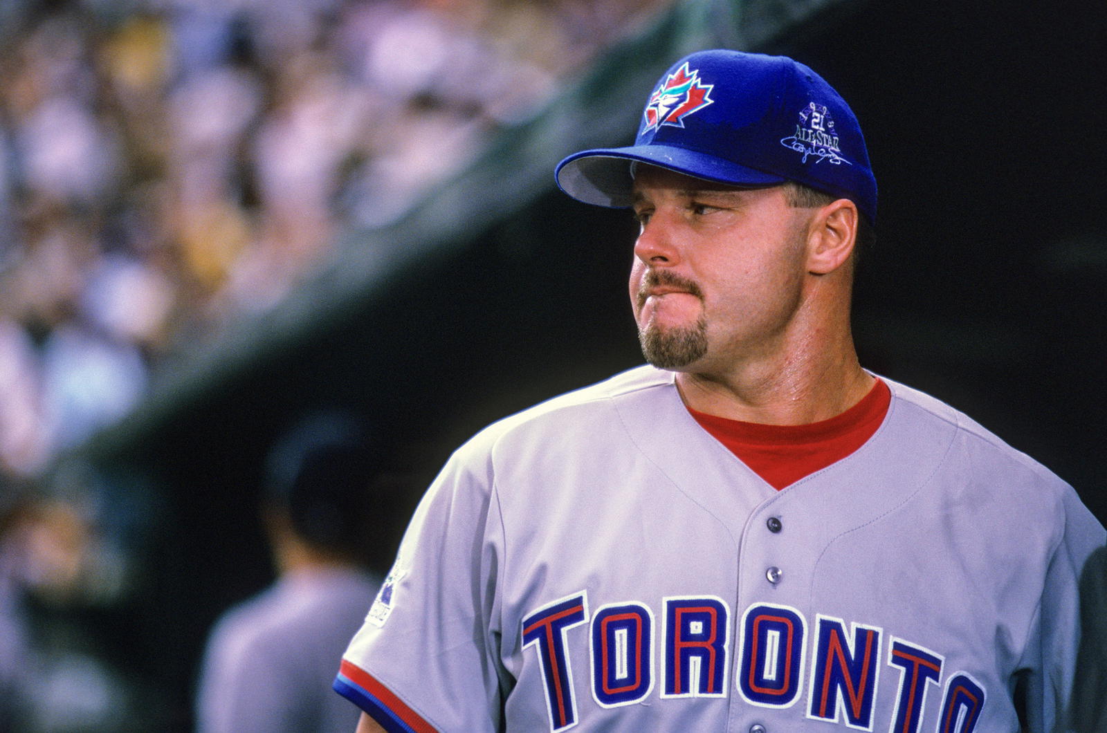 American League pitcher Roger Clemens (21) of the Toronto Blue Jays looks on from the dugout against the National League during the 1998 MLB All-Star Game at Coors Field. V.J. Lovero-USA TODAY NETWORK