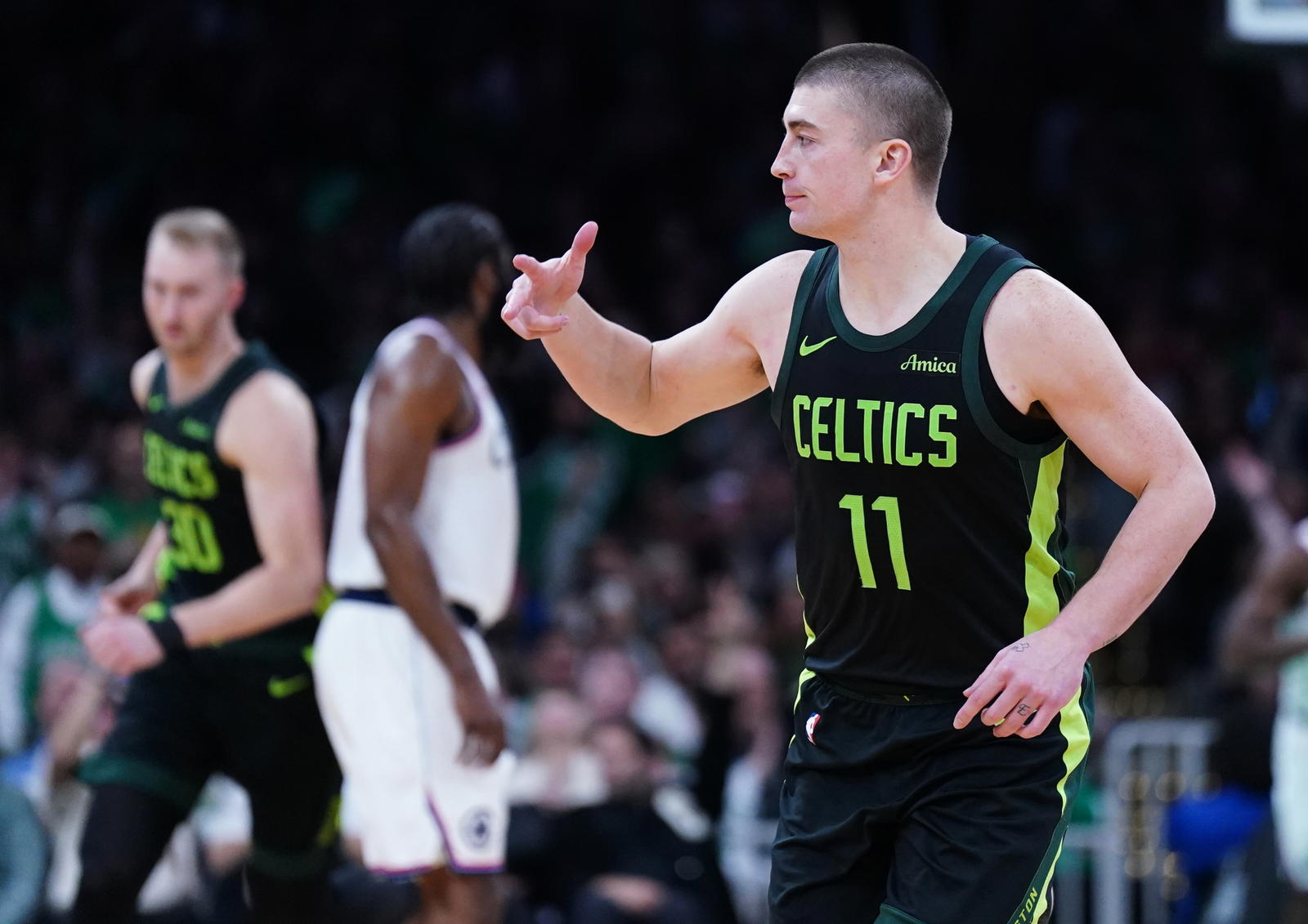 Nov 25, 2024; Boston, Massachusetts, USA; Boston Celtics guard Payton Pritchard (11) reacts after his three point basket against the LA Clippers in the second half at TD Garden. (David Butler II/Imagn Images)