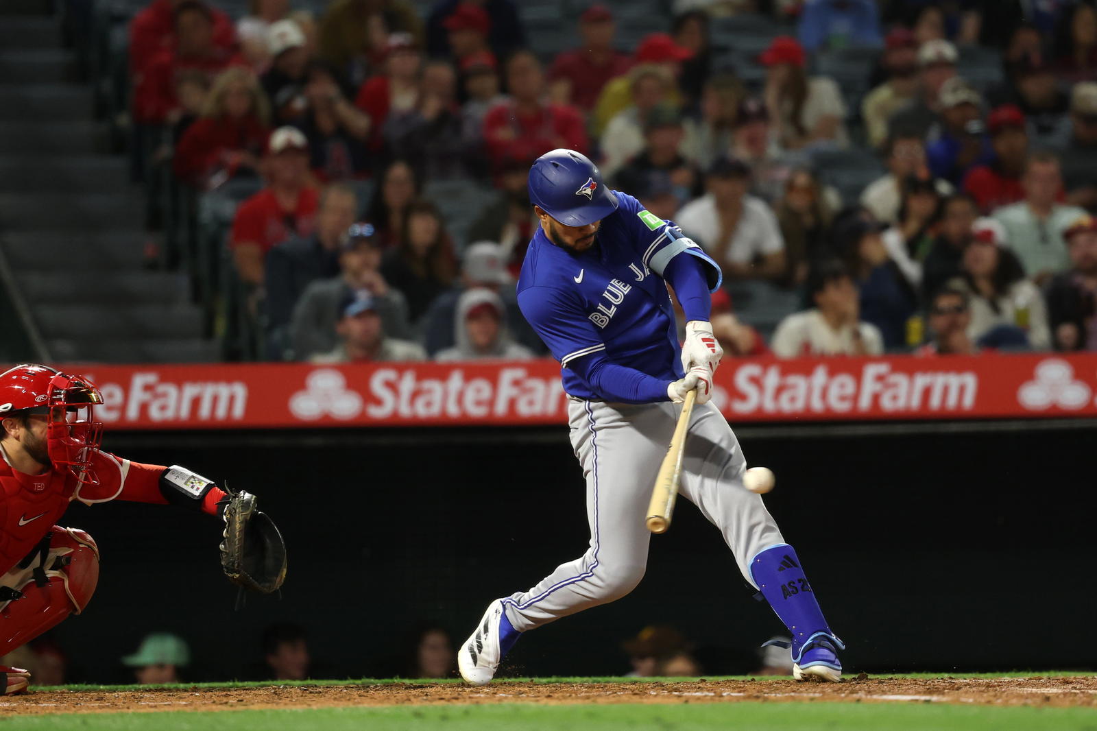 Toronto Blue Jays designated hitter Anthony Santander (25) hits an RBI single during the sixth inning against the Los Angeles Angels at Angel Stadium. Kiyoshi Mio-Imagn Images