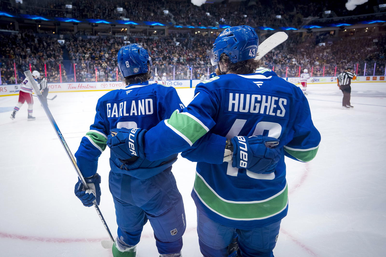 Nov 19, 2024; Vancouver, British Columbia, CAN; Vancouver Canucks forward Conor Garland (8) and defenseman Quinn Hughes (43) celebrate Garland’s goal against the New York Rangers during the second period at Rogers Arena. Mandatory Credit: Bob Frid-Imagn Images