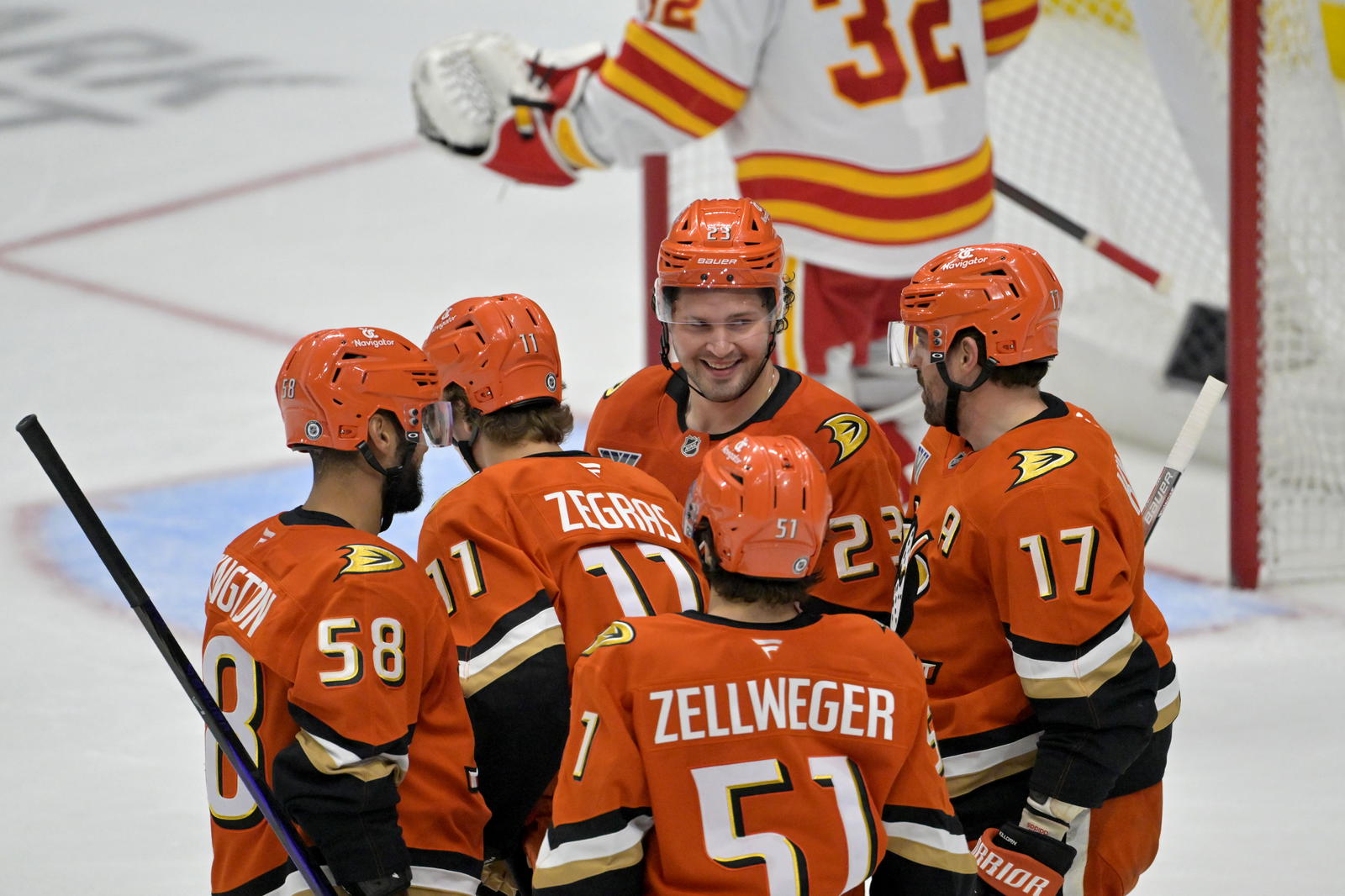 Apr 9, 2025; Anaheim, California, USA; Anaheim Ducks celebrate after a goal by center Trevor Zegras (11) during the third period against the Calgary Flames as Honda Center. Mandatory Credit: Jayne Kamin-Oncea-Imagn Images