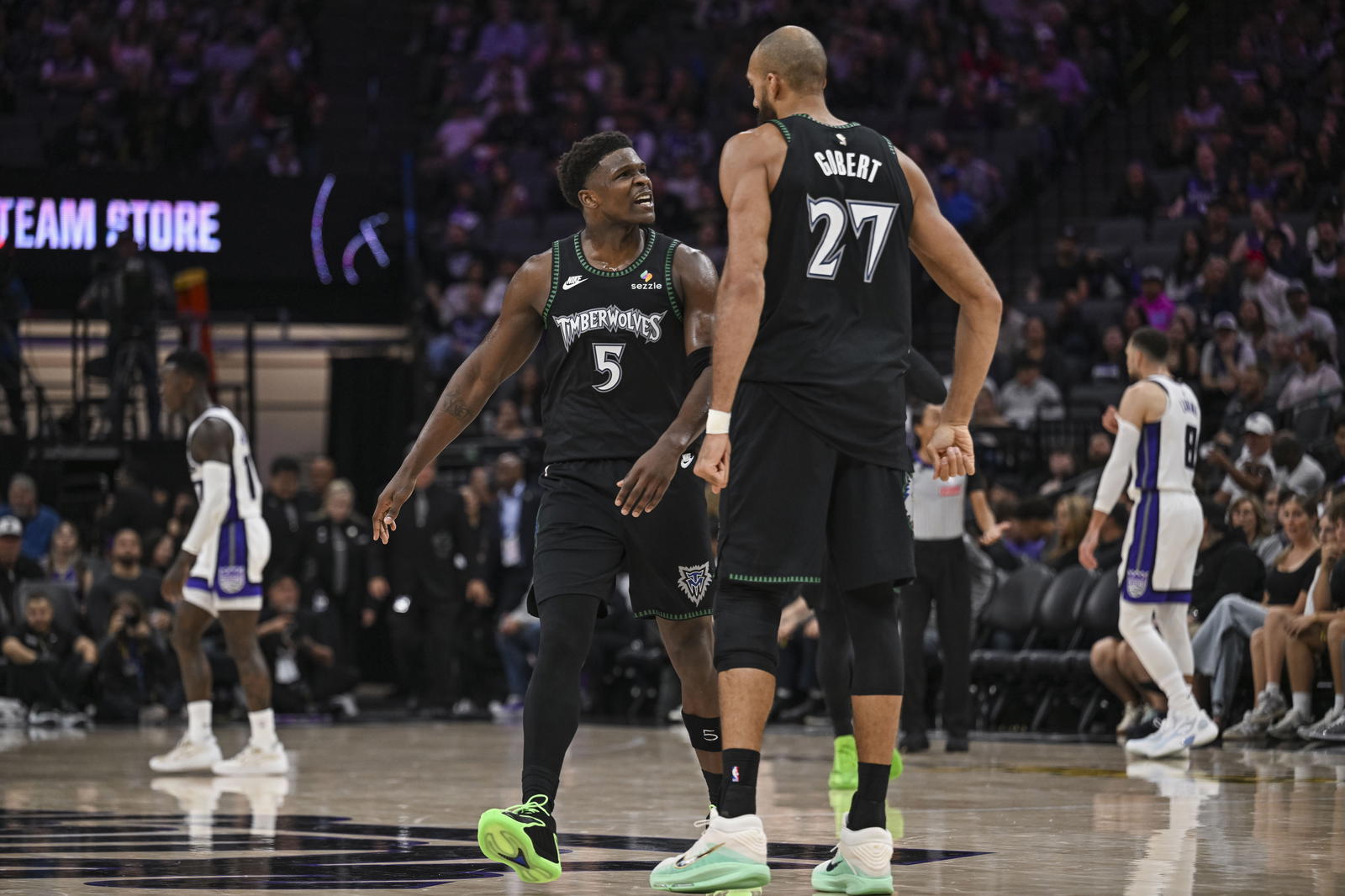 Minnesota Timberwolves guard Anthony Edwards (5) and center Rudy Gobert (27) react during the second quarter at Golden 1 Center.&nbsp;Justine Willard-Imagn Images