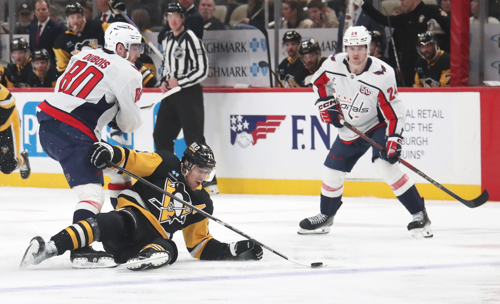 Feb 22, 2025; Pittsburgh, Pennsylvania, USA; Washington Capitals left wing Pierre-Luc Dubois (80) checks Pittsburgh Penguins center Evgeni Malkin (71) to the ice during the second period at PPG Paints Arena. Mandatory Credit: Charles LeClaire-Imagn Images